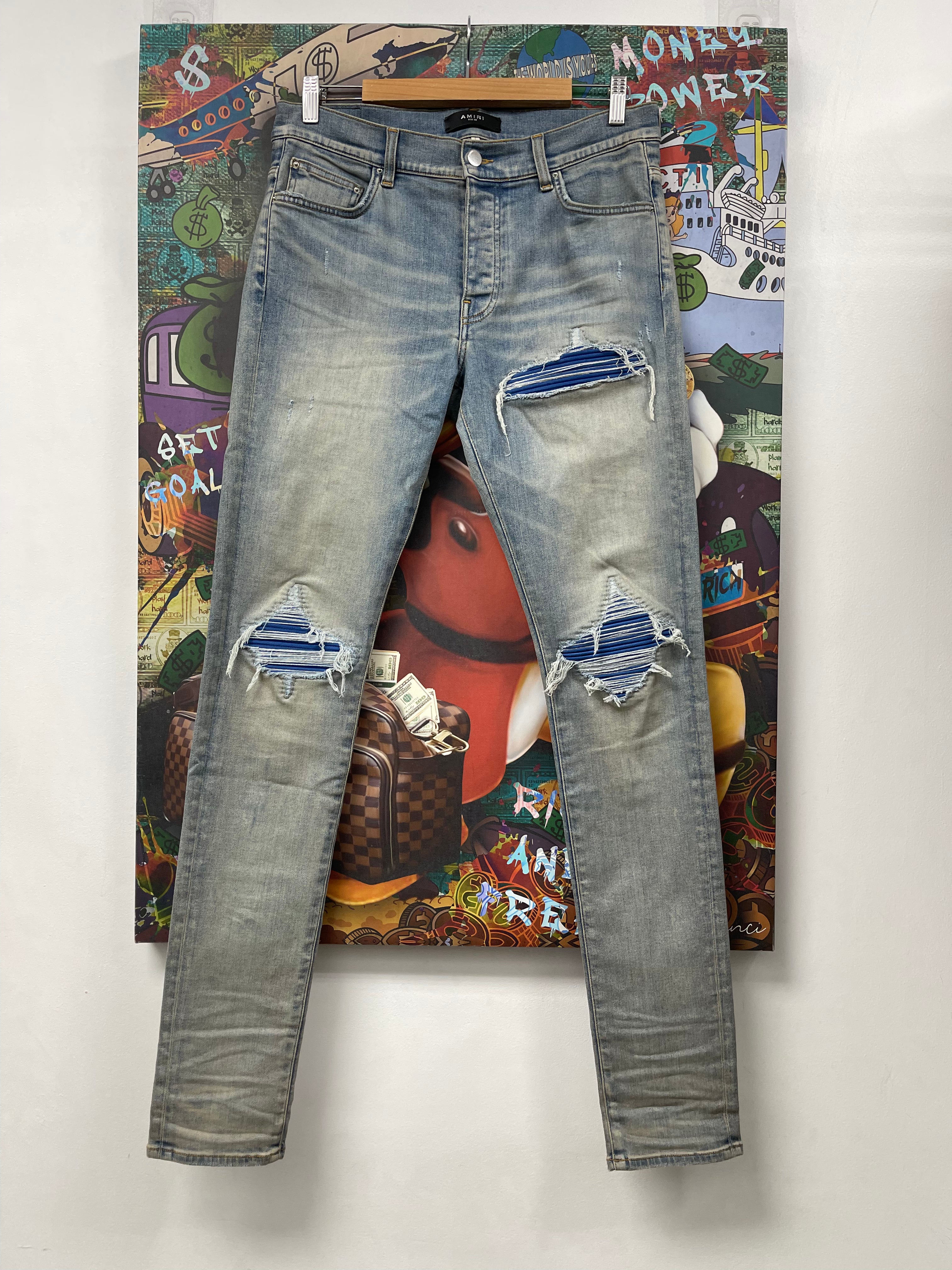Amiri MX1 Light Wash Blue Ultra Suede Patch Jeans