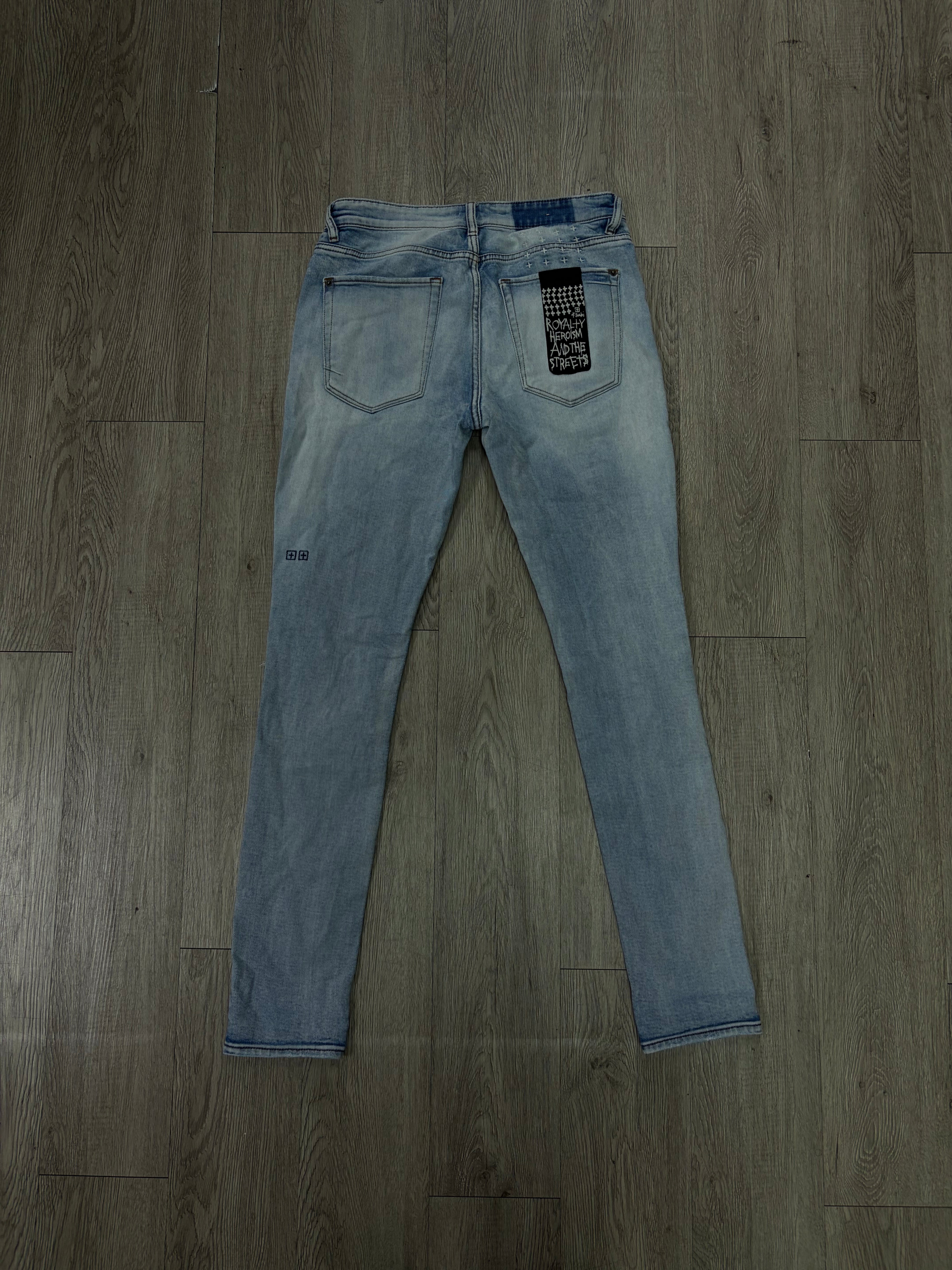 Ksubi Light Wash Ripped Knee Logo Jeans