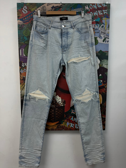 Amiri MX1 Light Wash White Patch Jeans
