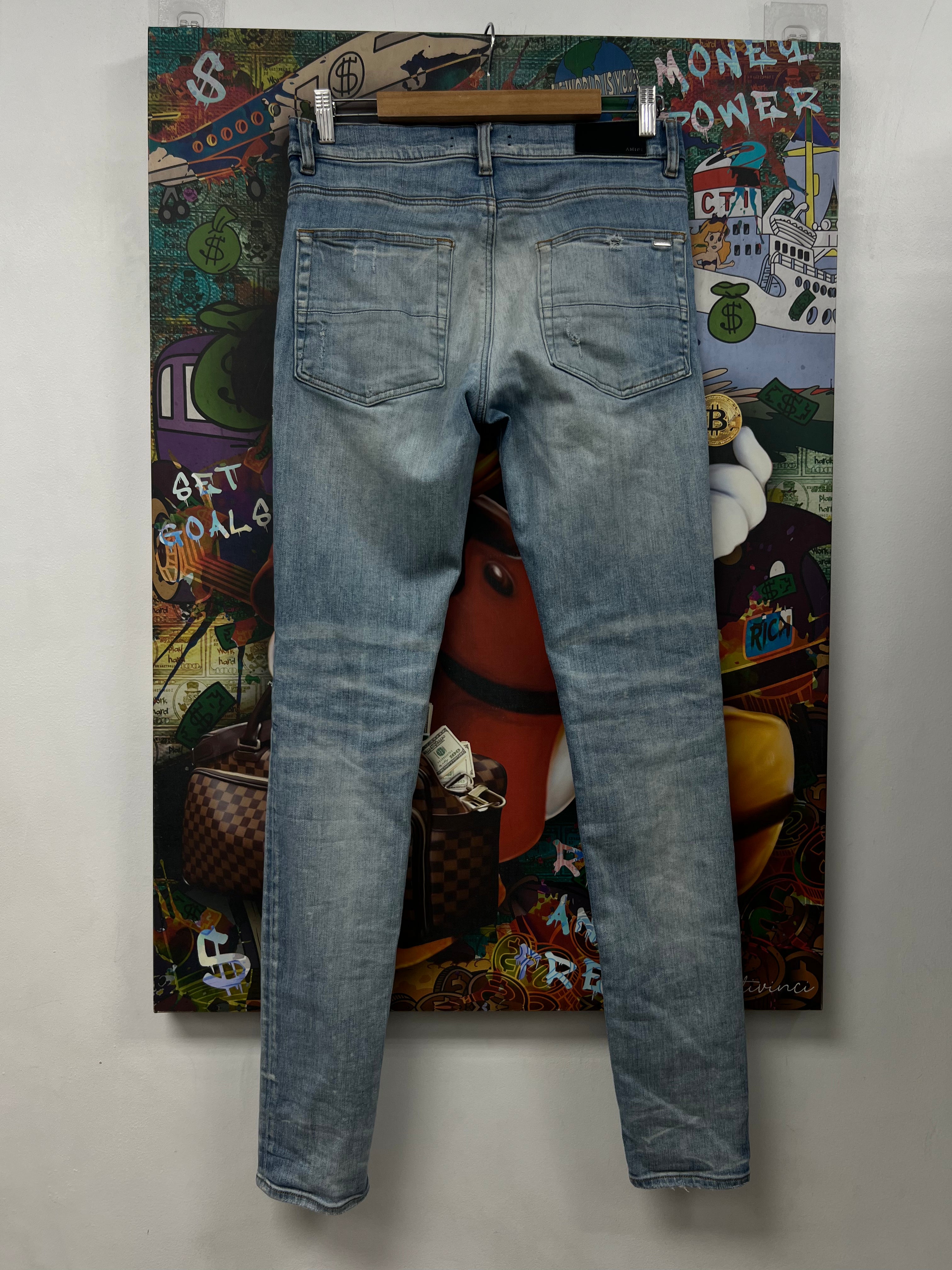 Amiri MX1 Light Wash White Patch Jeans