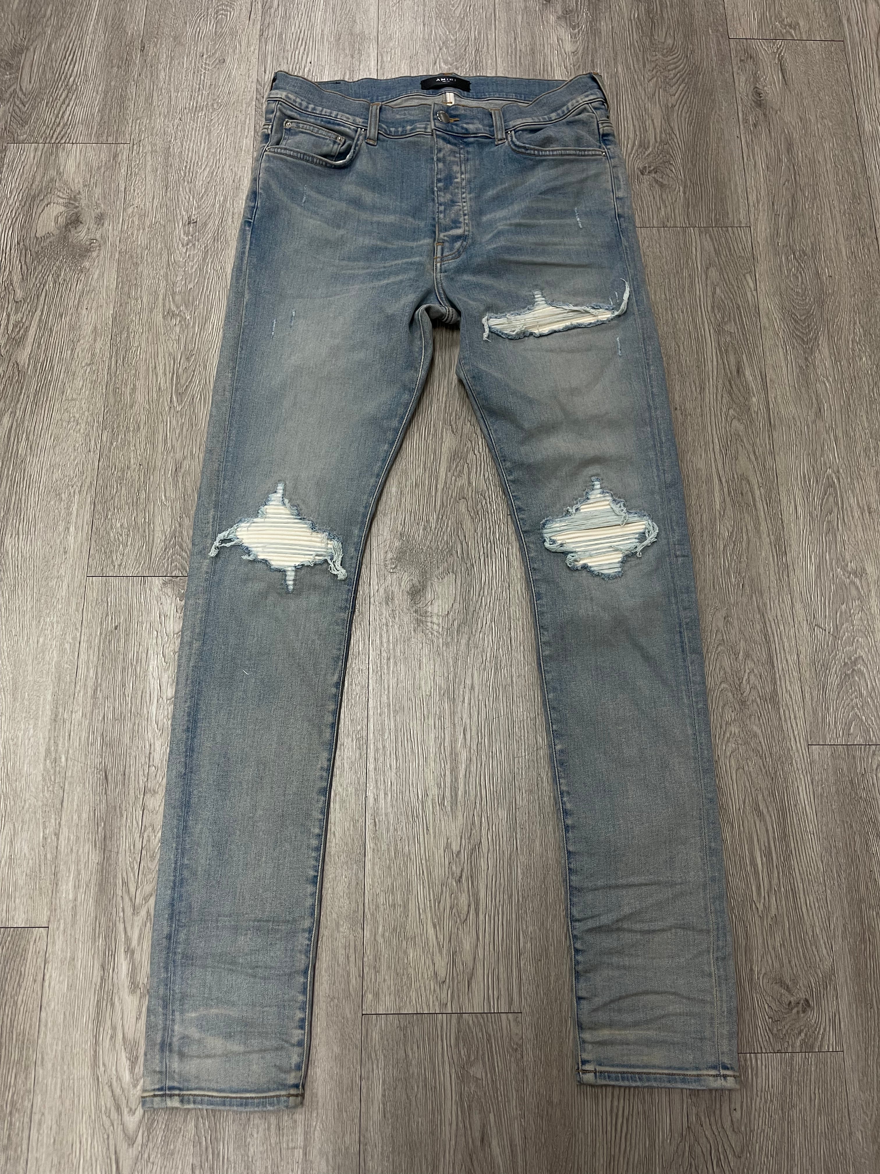 Amiri MX1 Light Wash White Patch Jeans