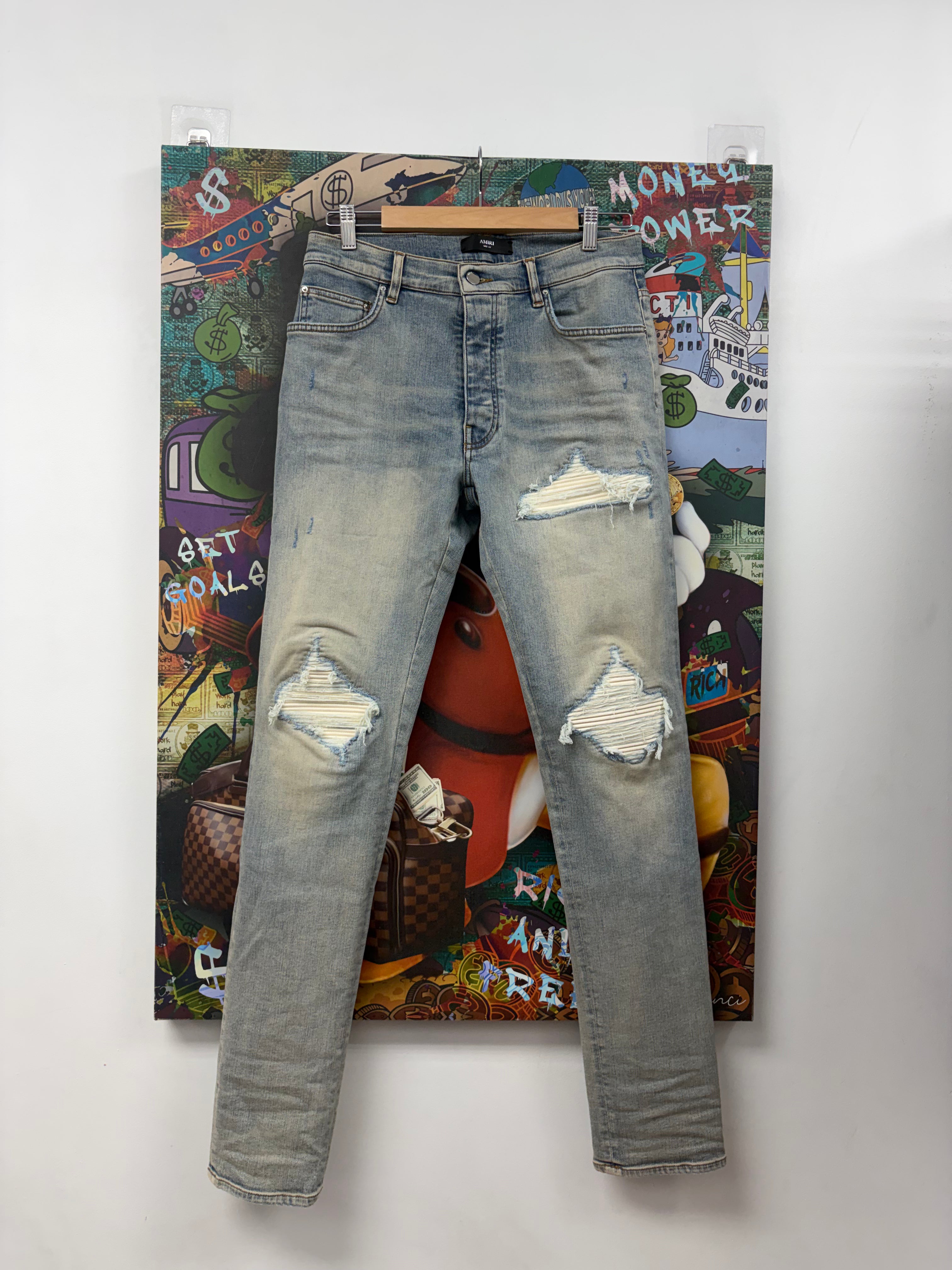 Amiri MX1 Light Wash White Patch Jeans