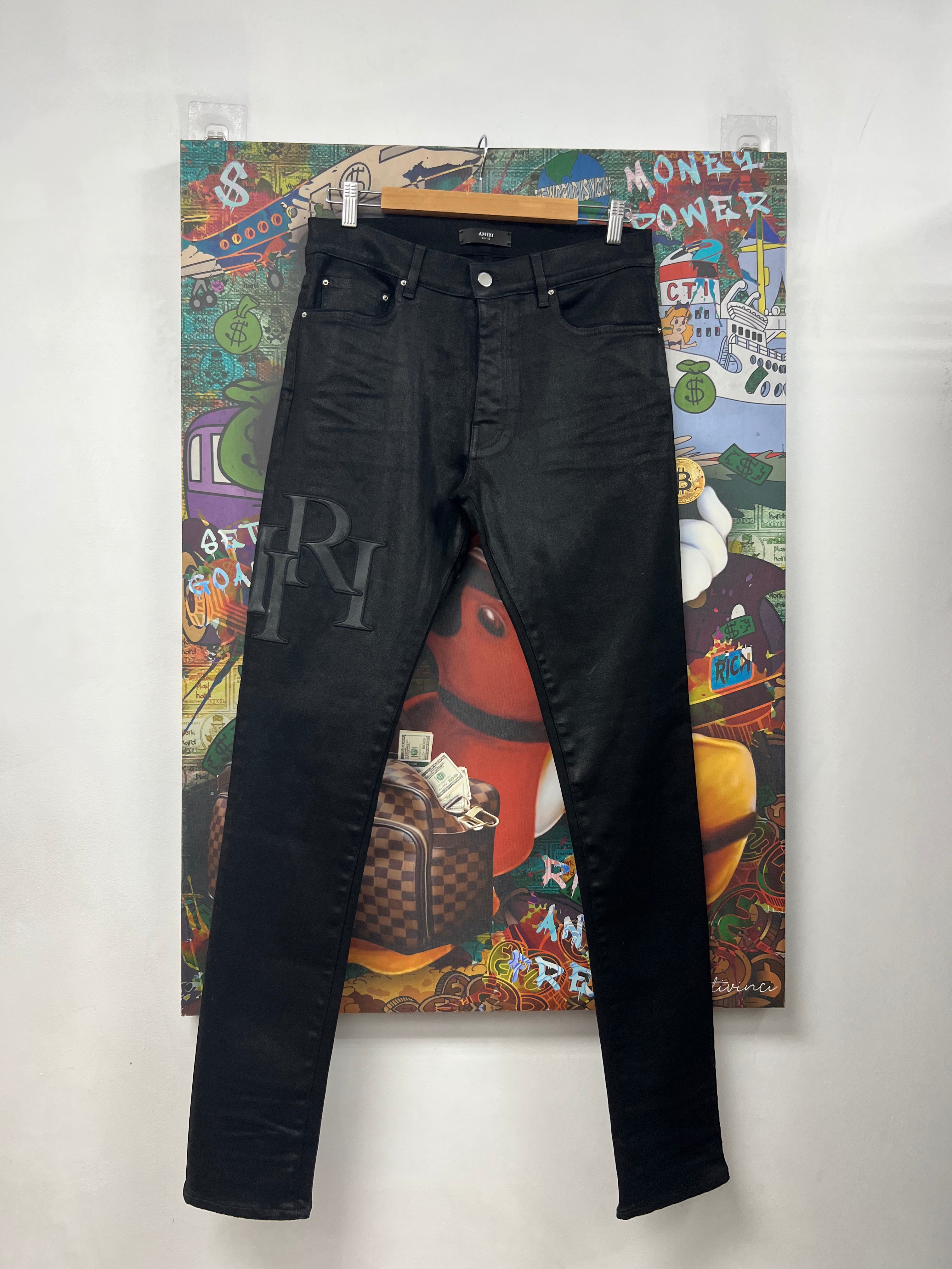 Amiri Black Wax Staggered Logo Jeans