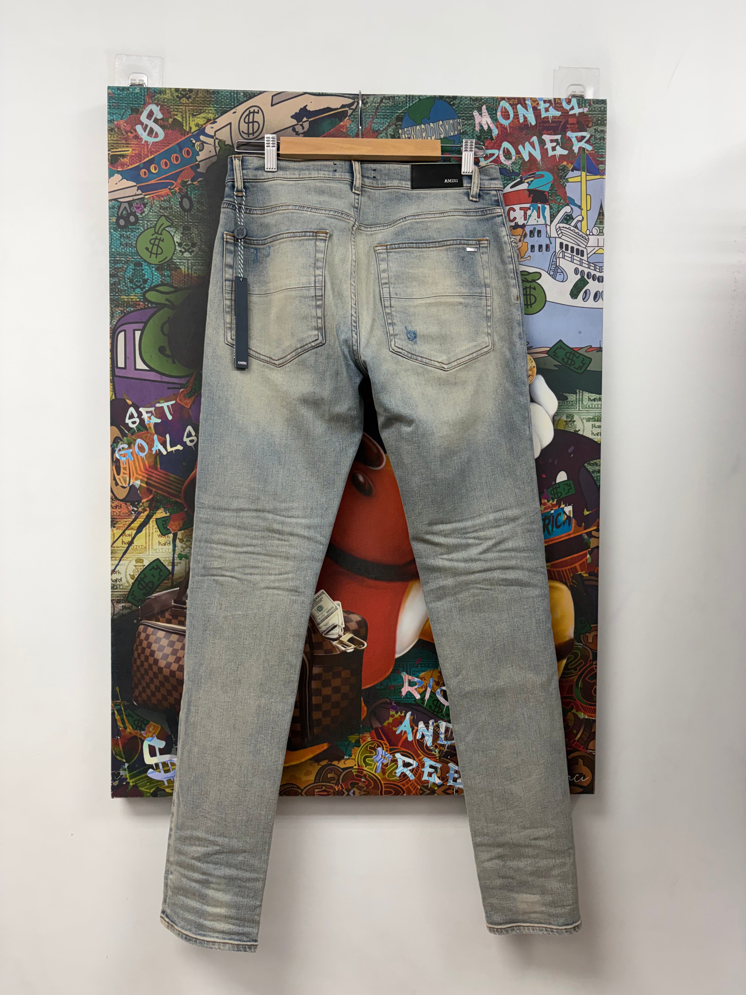 Amiri MX1 Light Wash White Patch Jeans
