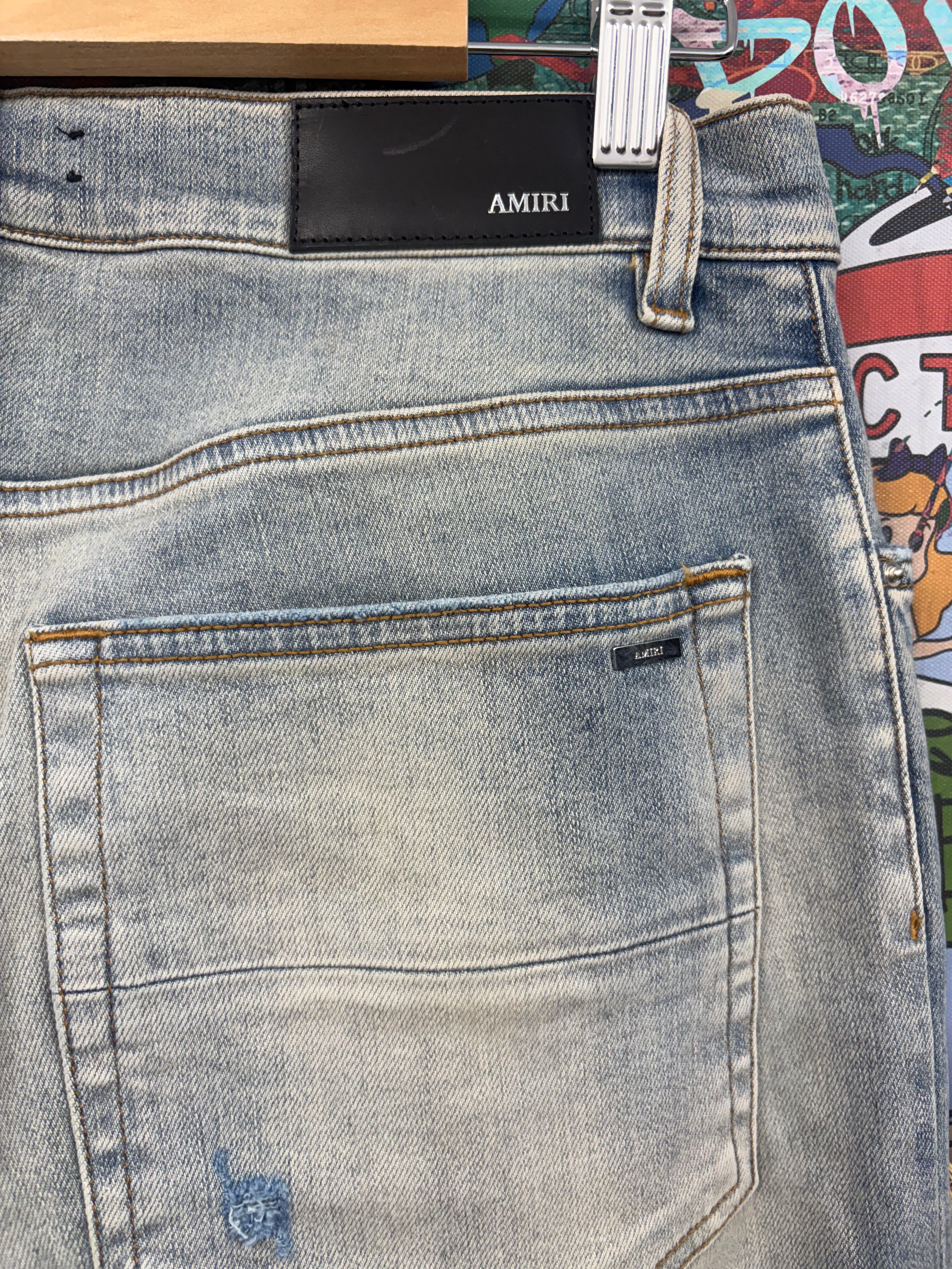 Amiri MX1 Light Wash White Patch Jeans