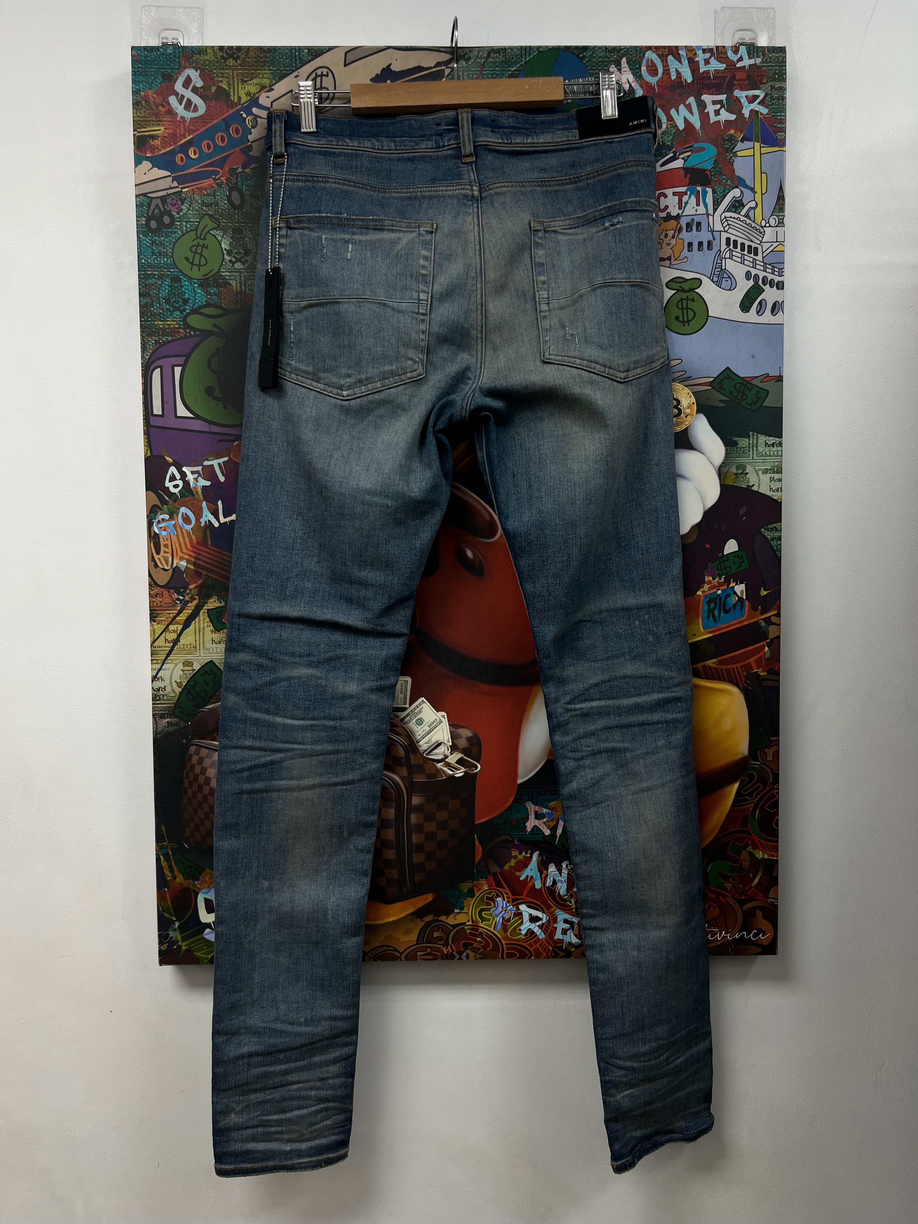 Amiri MX1 Light Wash Red Suede Patch Jeans