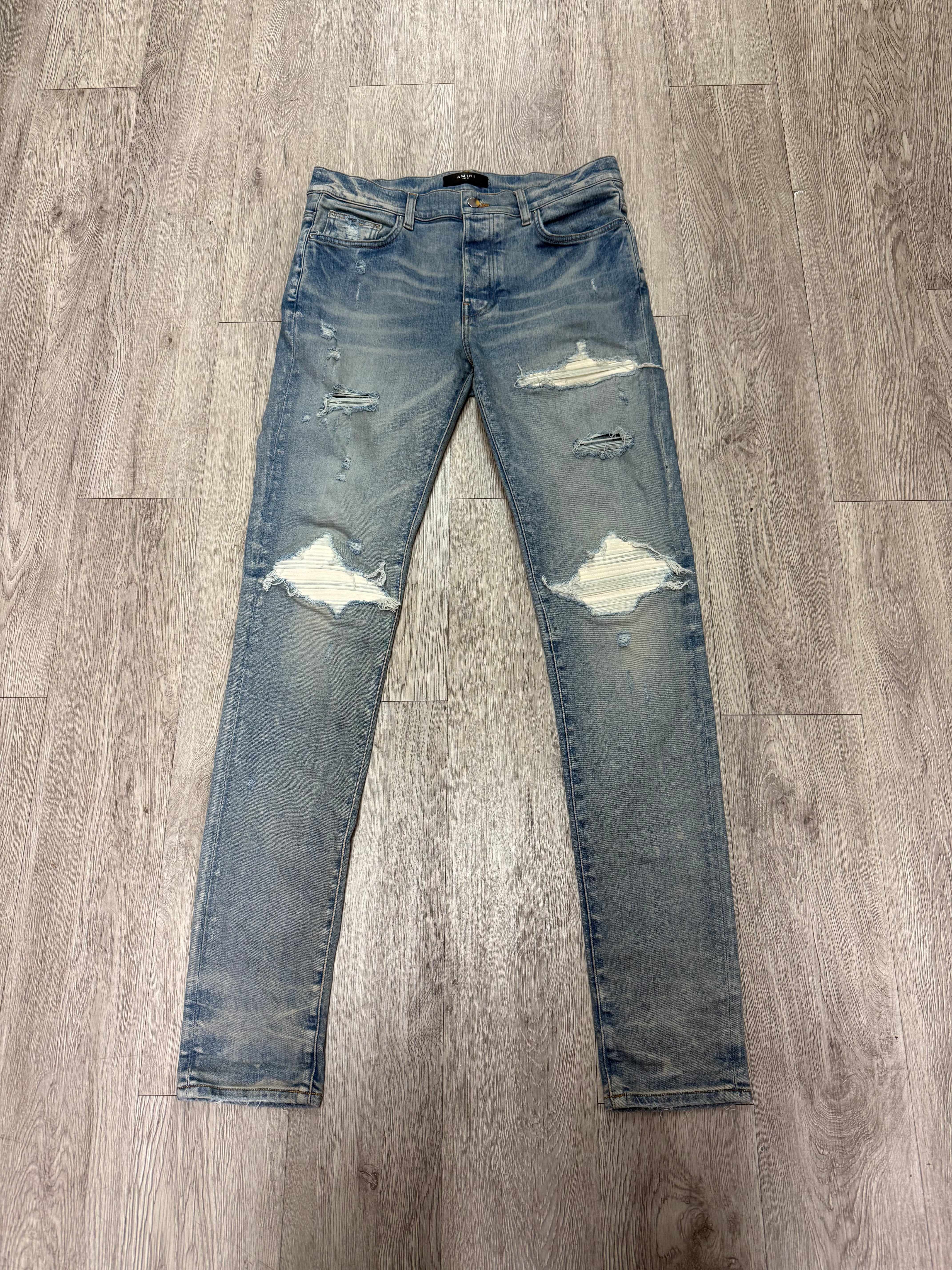 Amiri MX1 Light Wash White Ultra Suede Patch Jeans