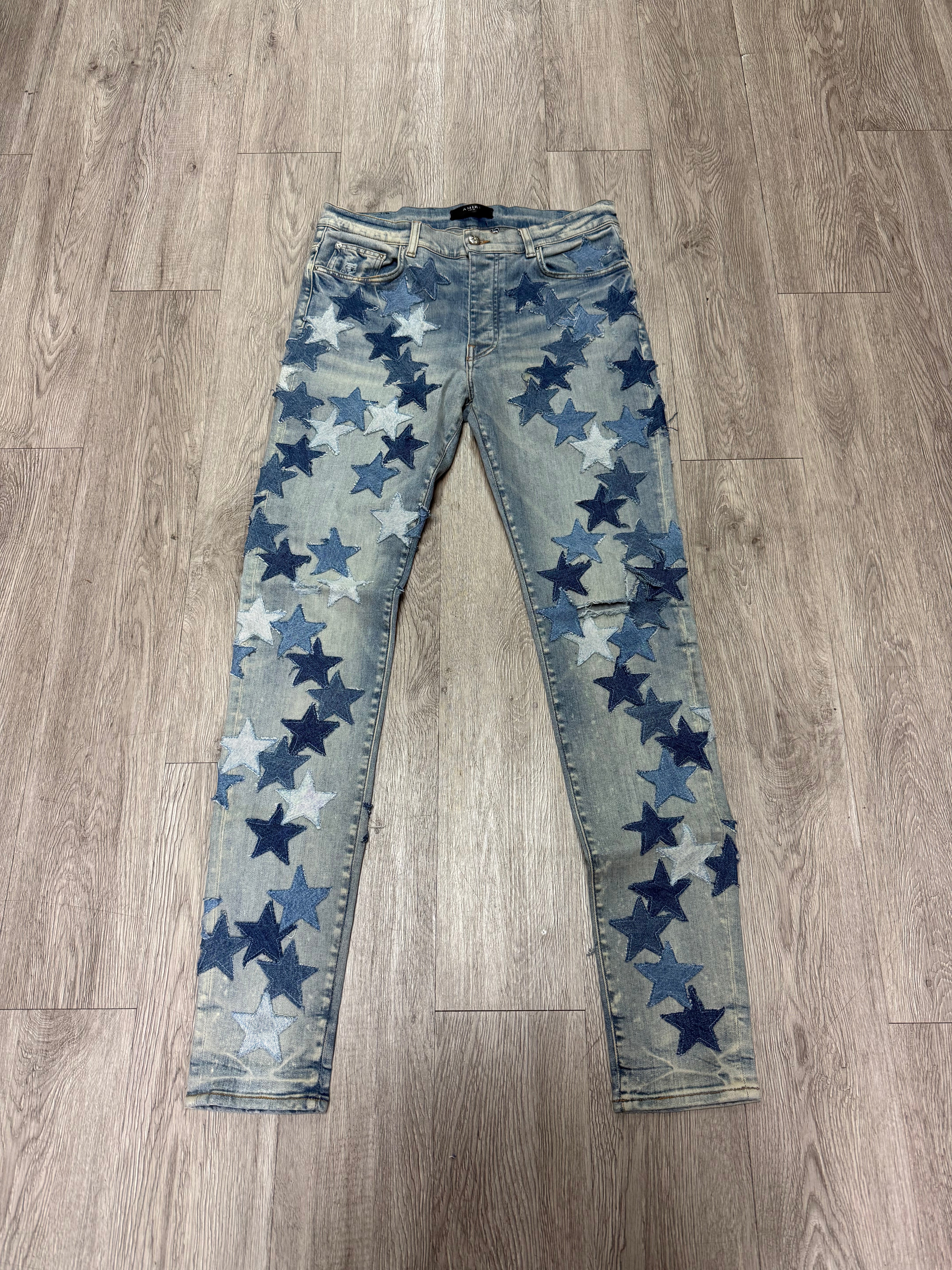 Amiri Light Wash Denim Chemist Stars Jeans