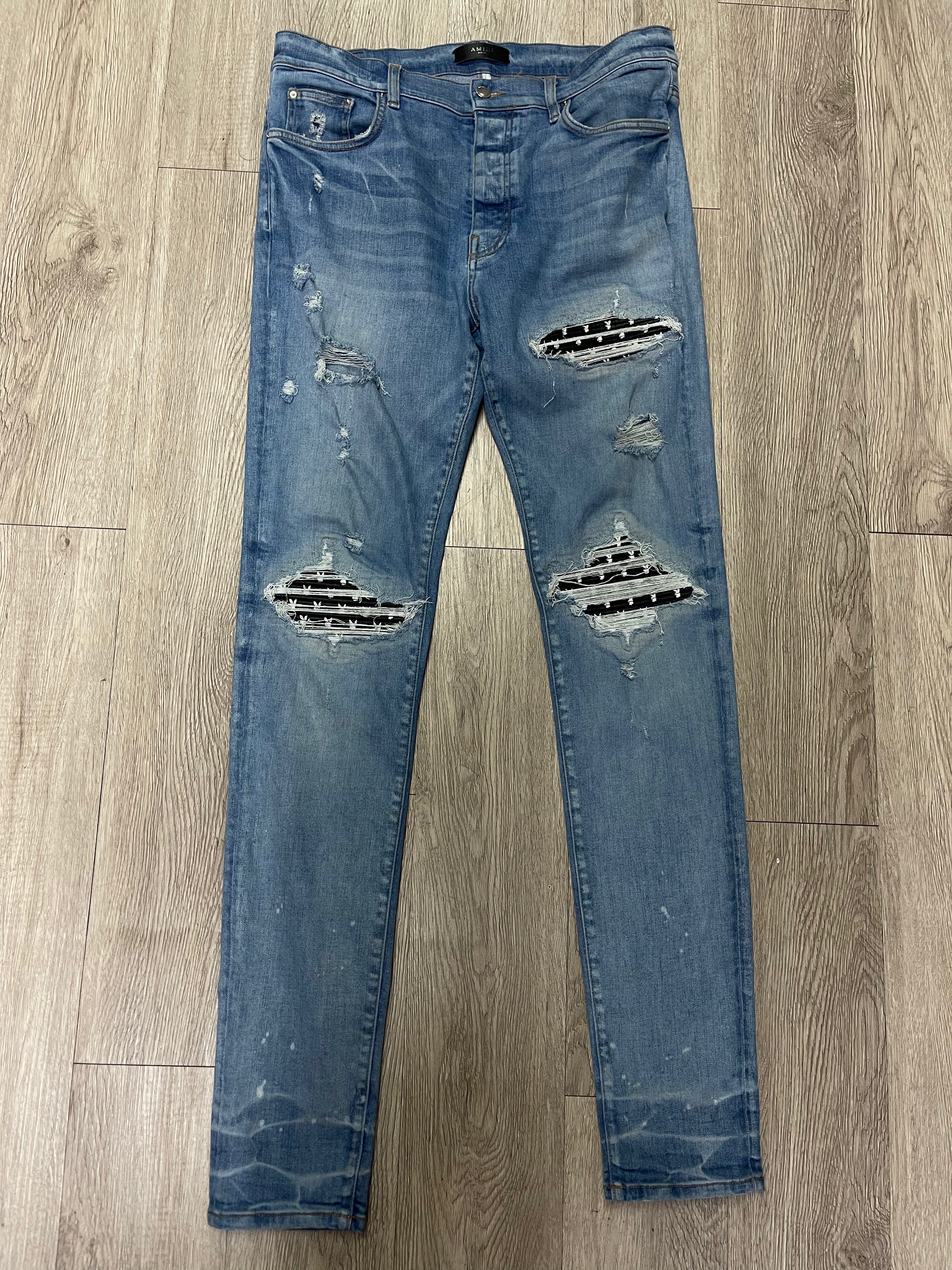 Amiri MX1 Light Wash Black Leather Playboy Patch Jeans