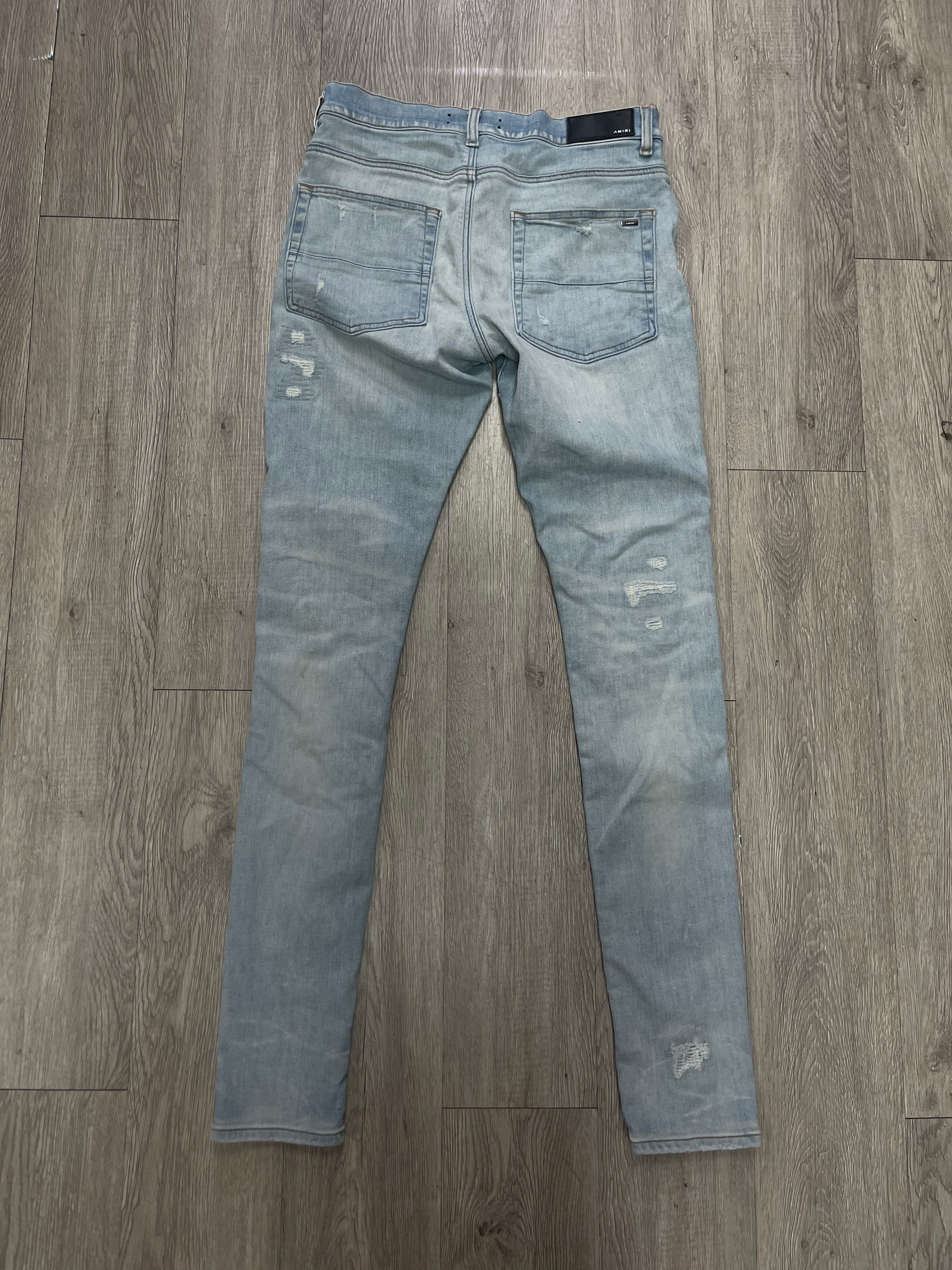 Amiri Light Wash Double Knee Distressed Jeans