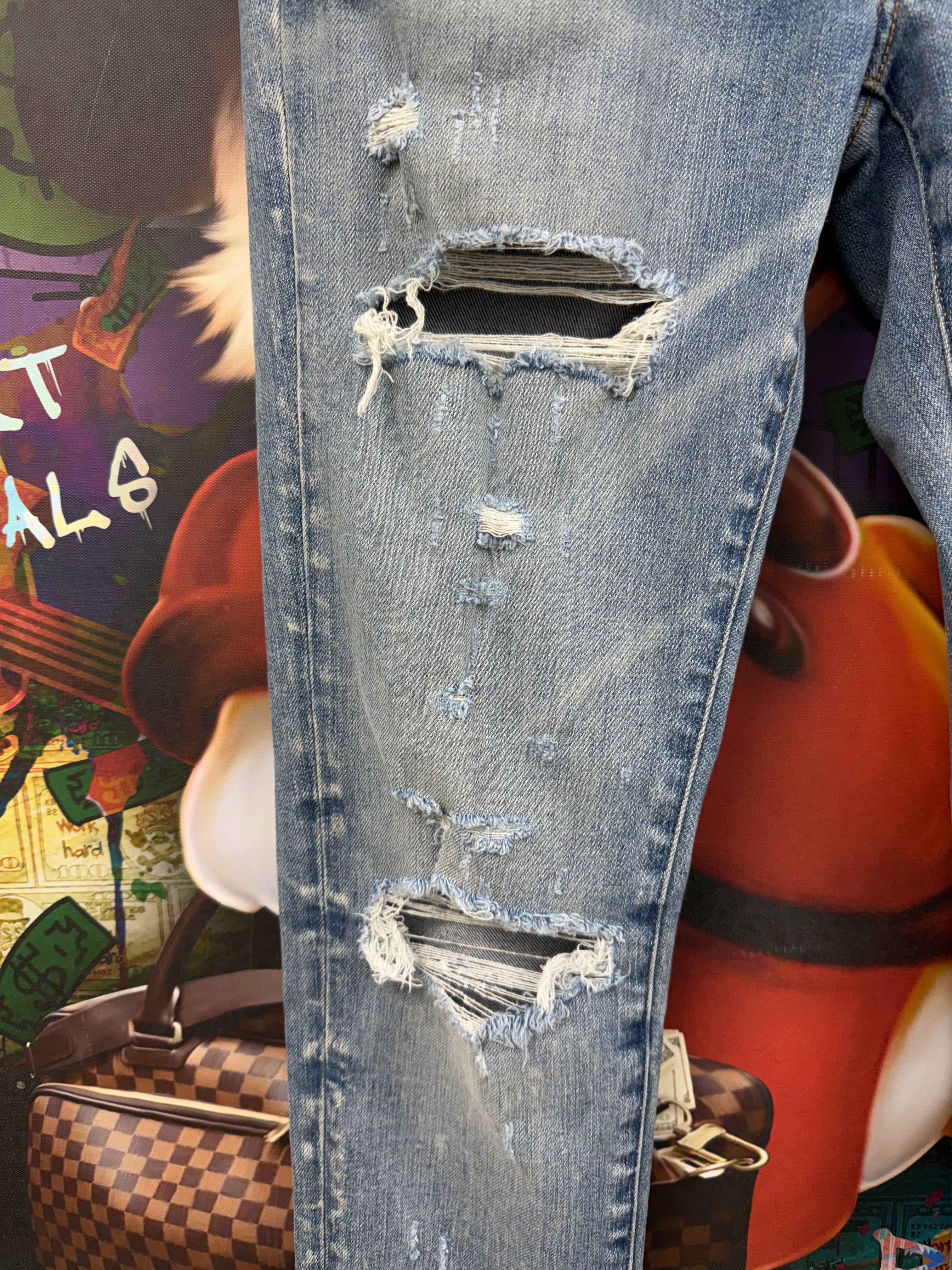 Amiri Light Wash Rip Jeans