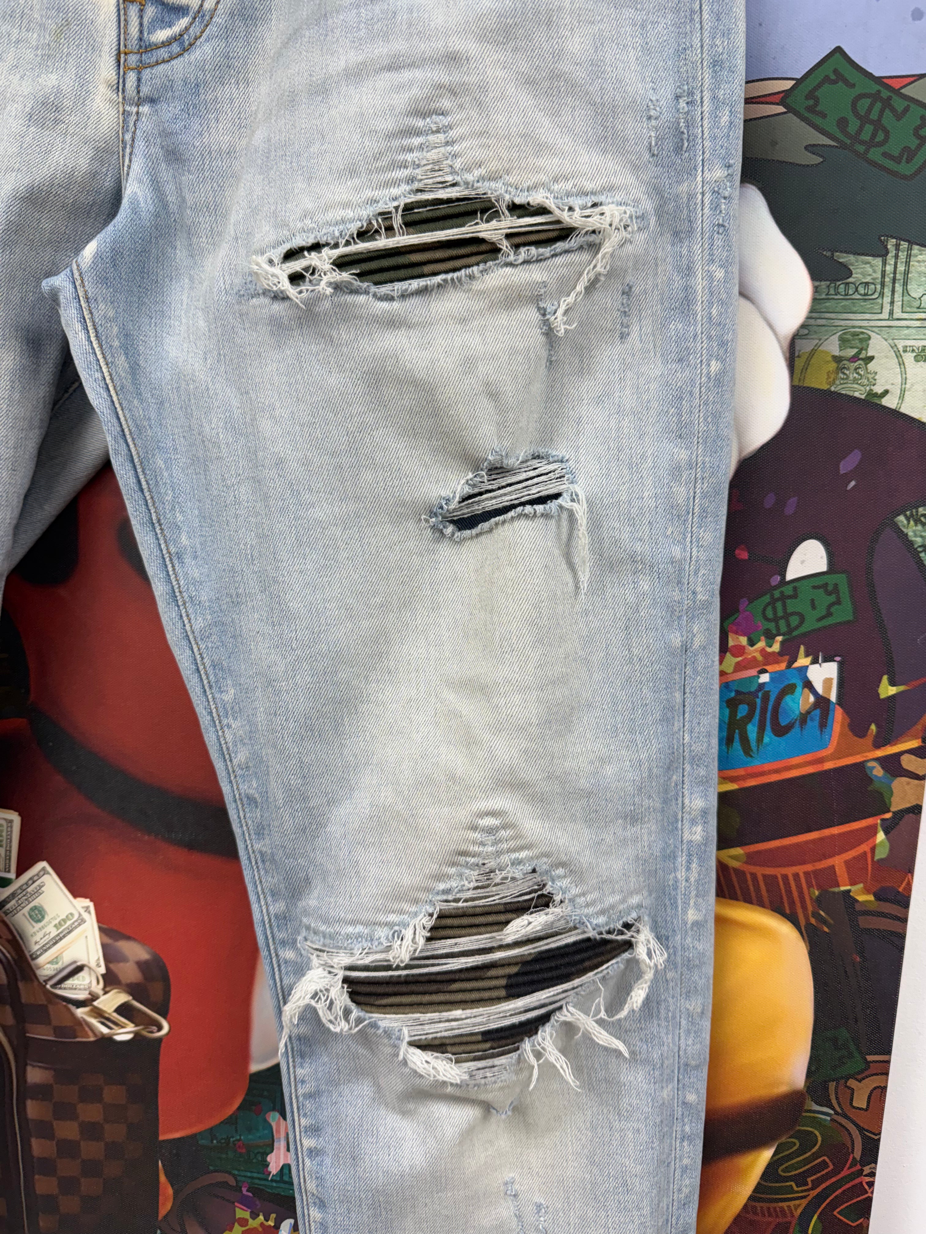 Amiri MX1 Light Wash Camo Patch Jeans