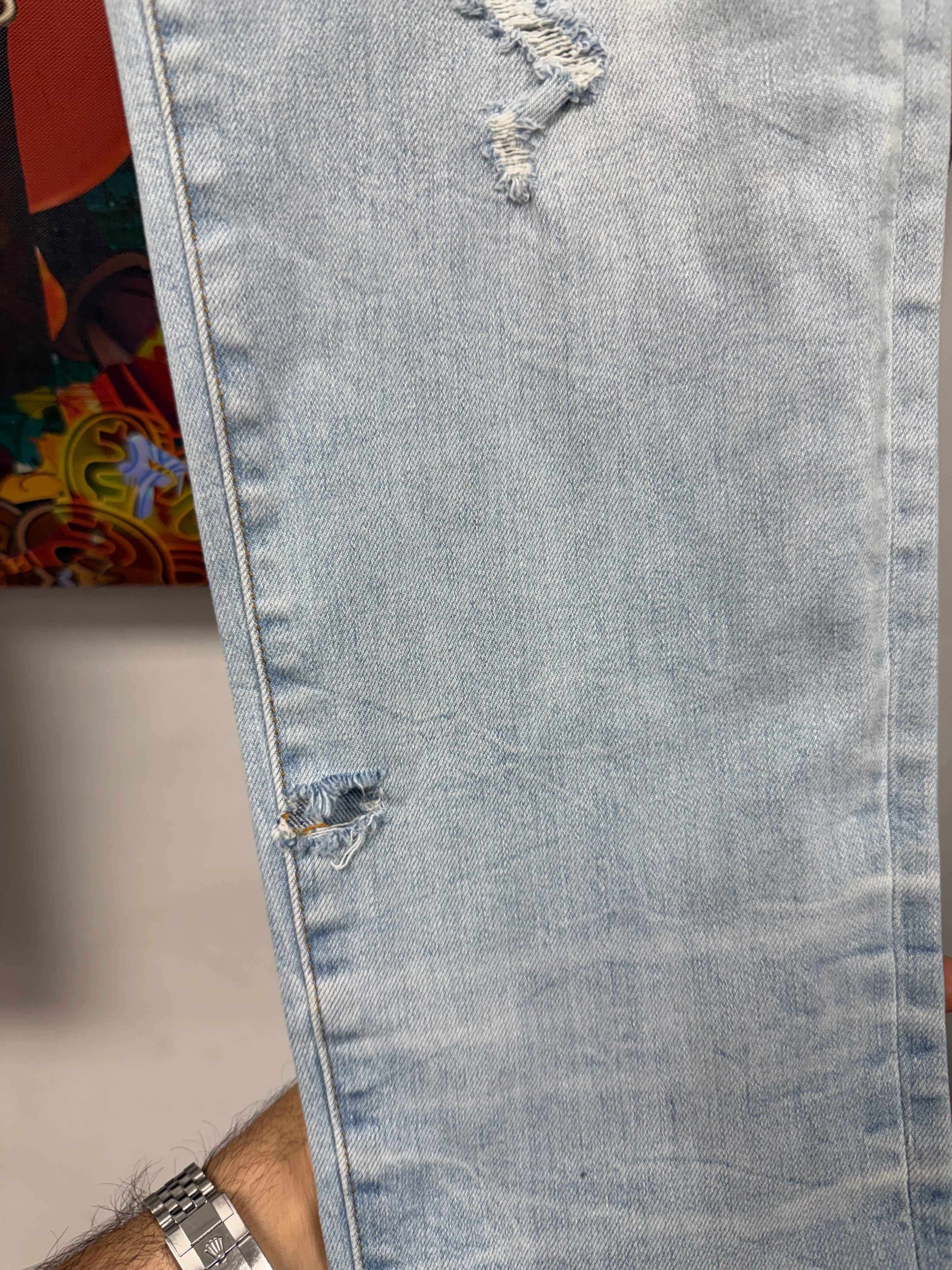 Amiri Light Wash Animation Thrasher Patch Jeans