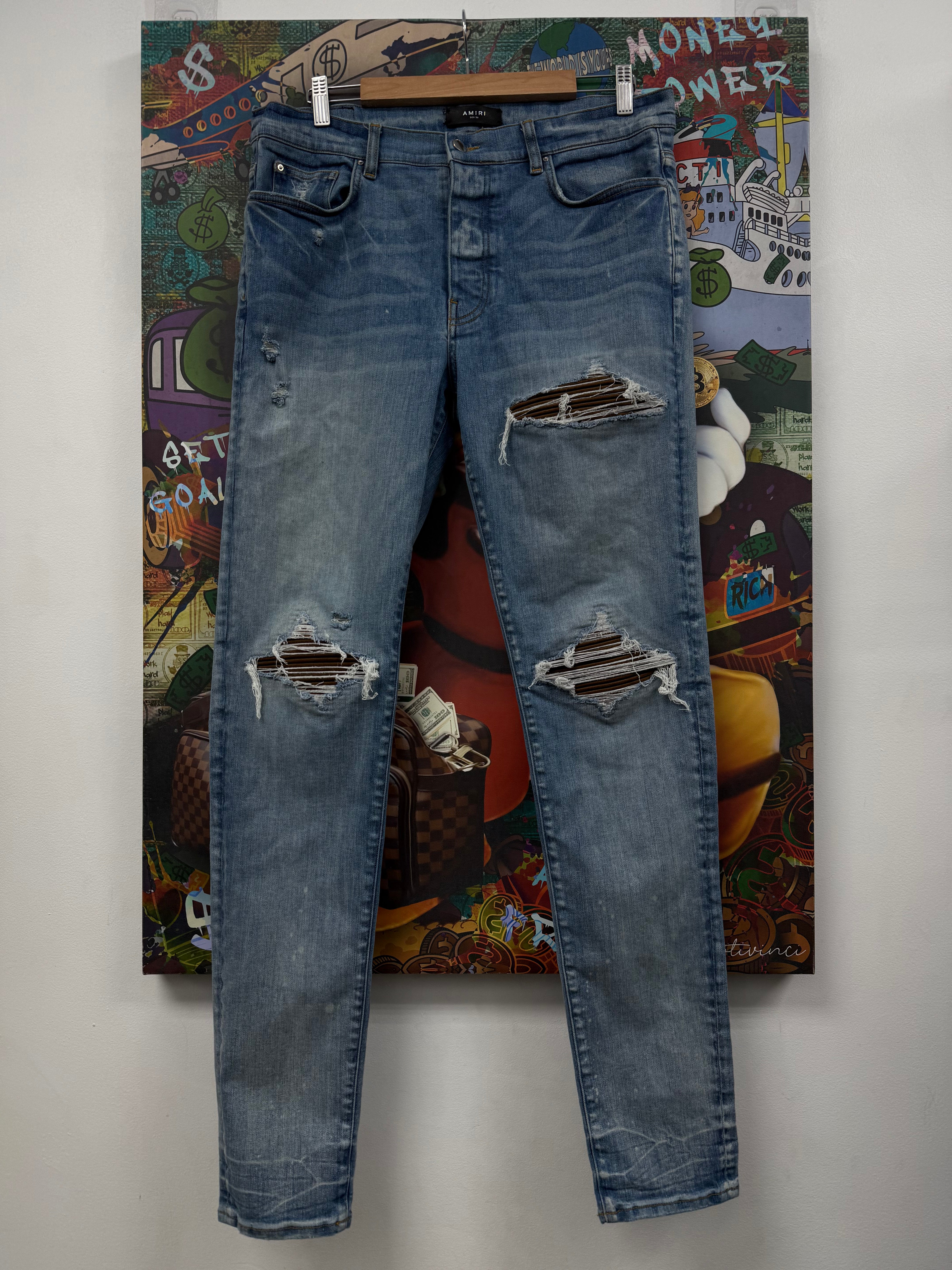 Amiri MX1 Light Wash Brown Patch Jeans