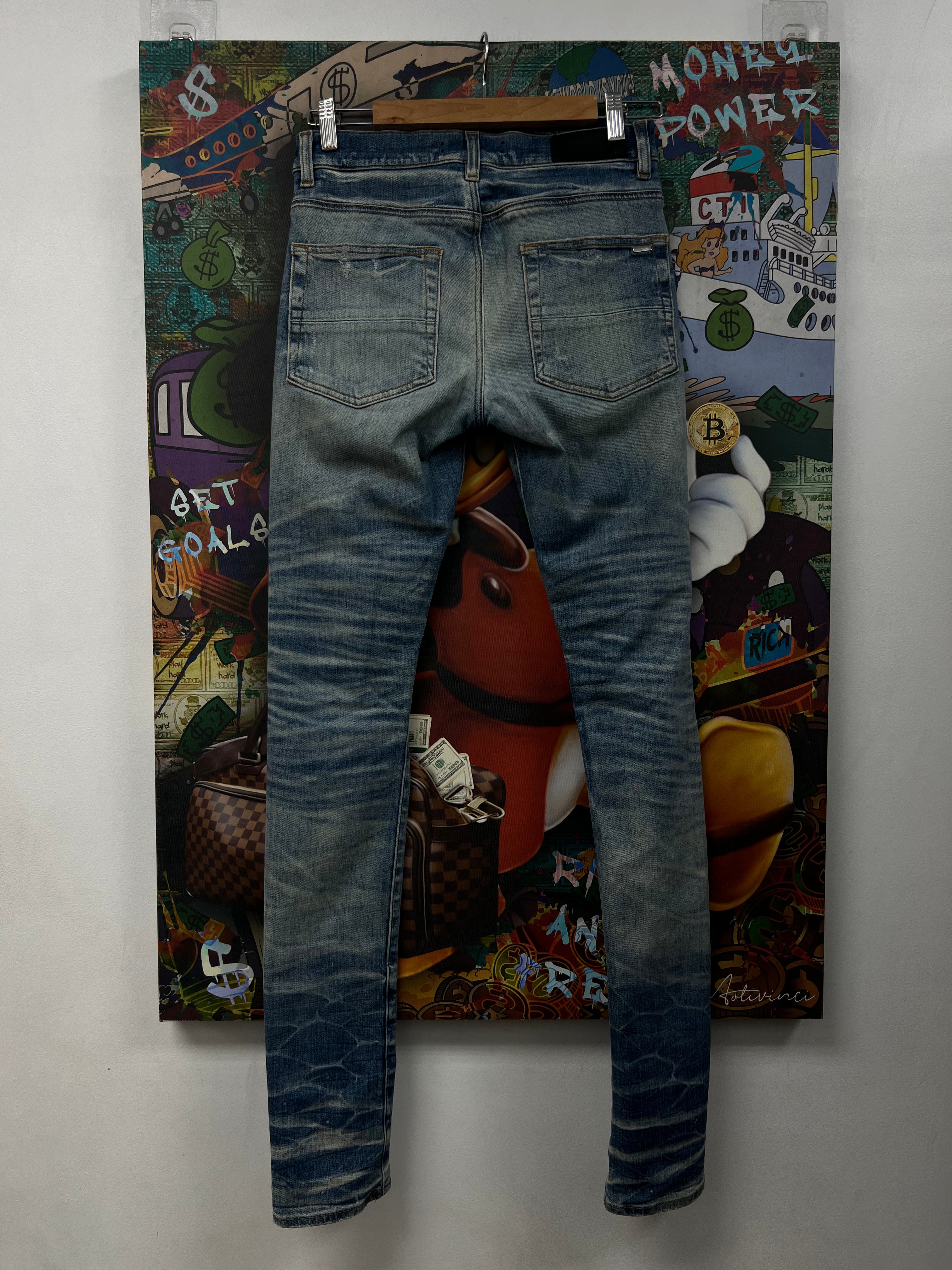 Amiri Light Wash Black Sequin Thrasher Patch Jeans