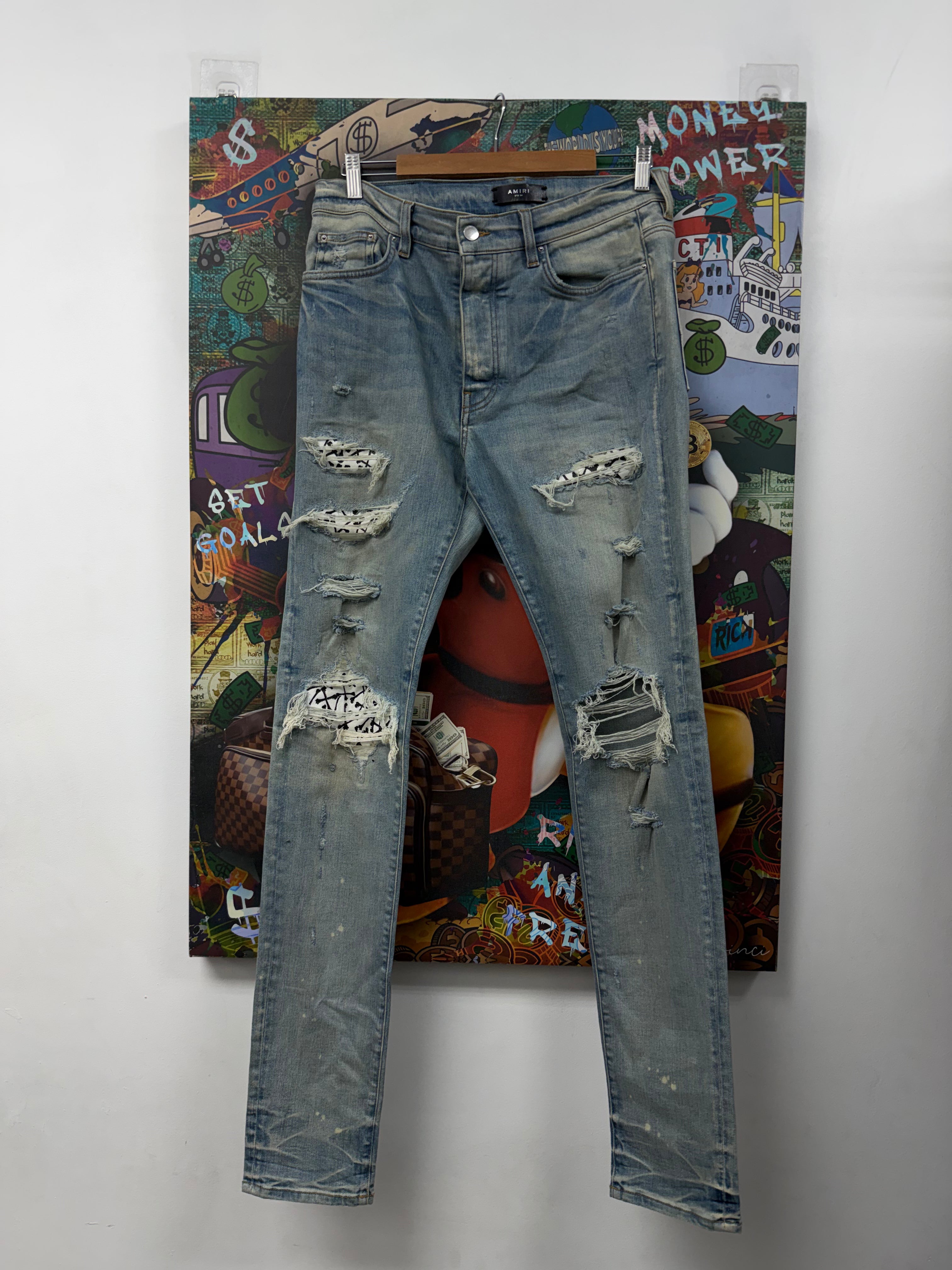 Amiri Light Wash Bones Thrasher Patch Jeans