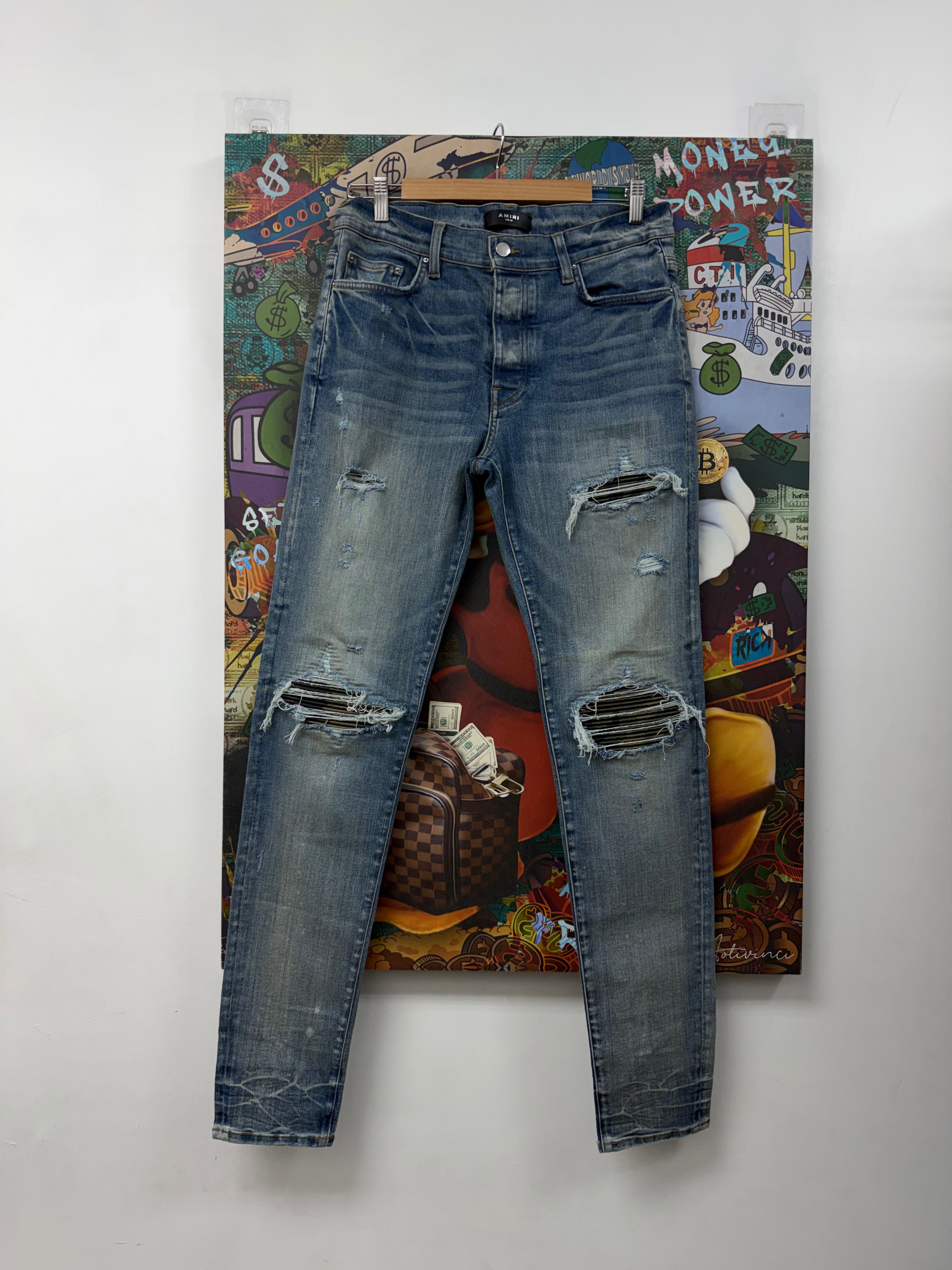 Amiri MX1 Light Wash Camo Patch Jeans
