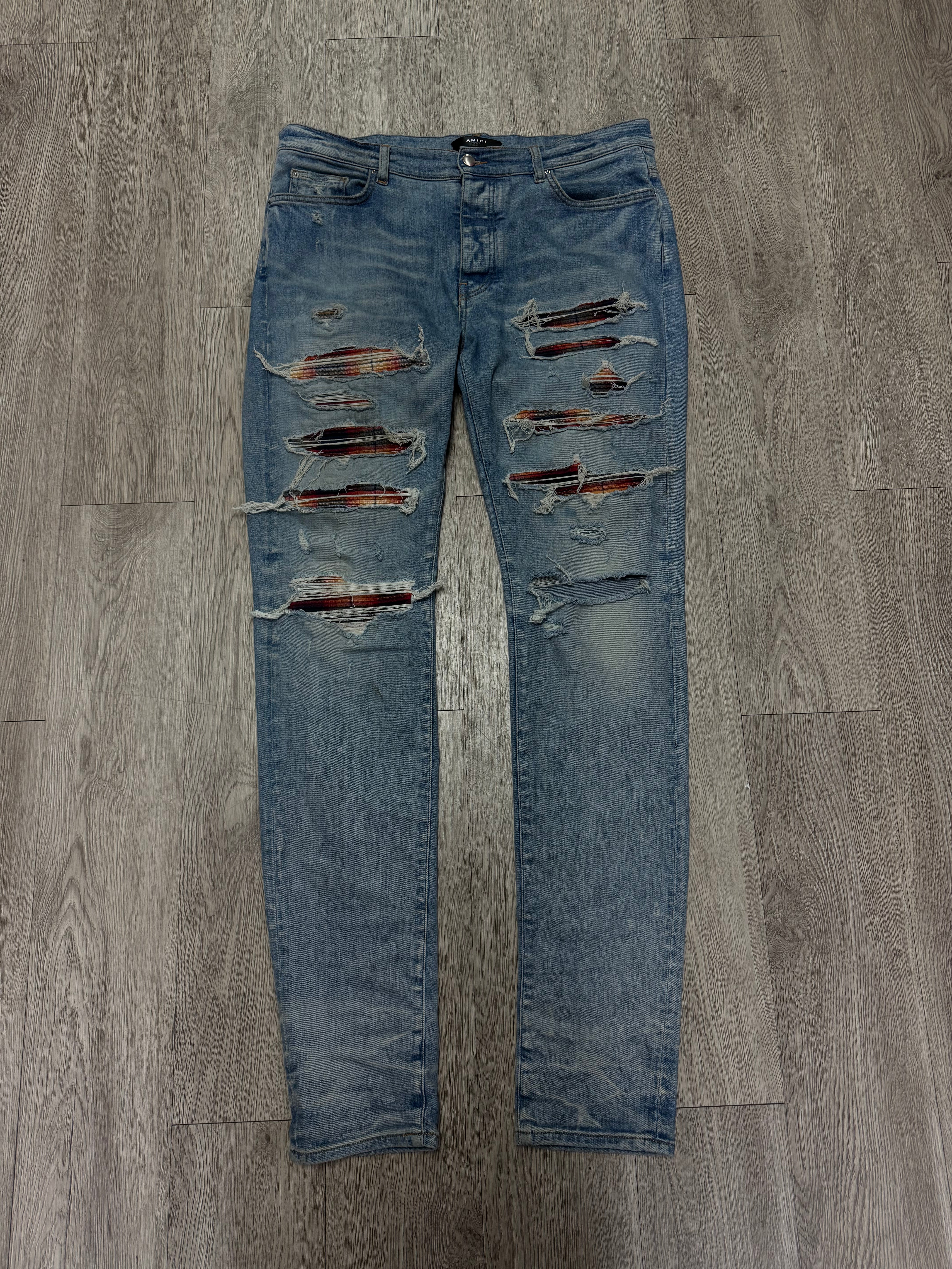 Amiri Light Wash Orange Navy Sunset Thrasher Patch Jeans