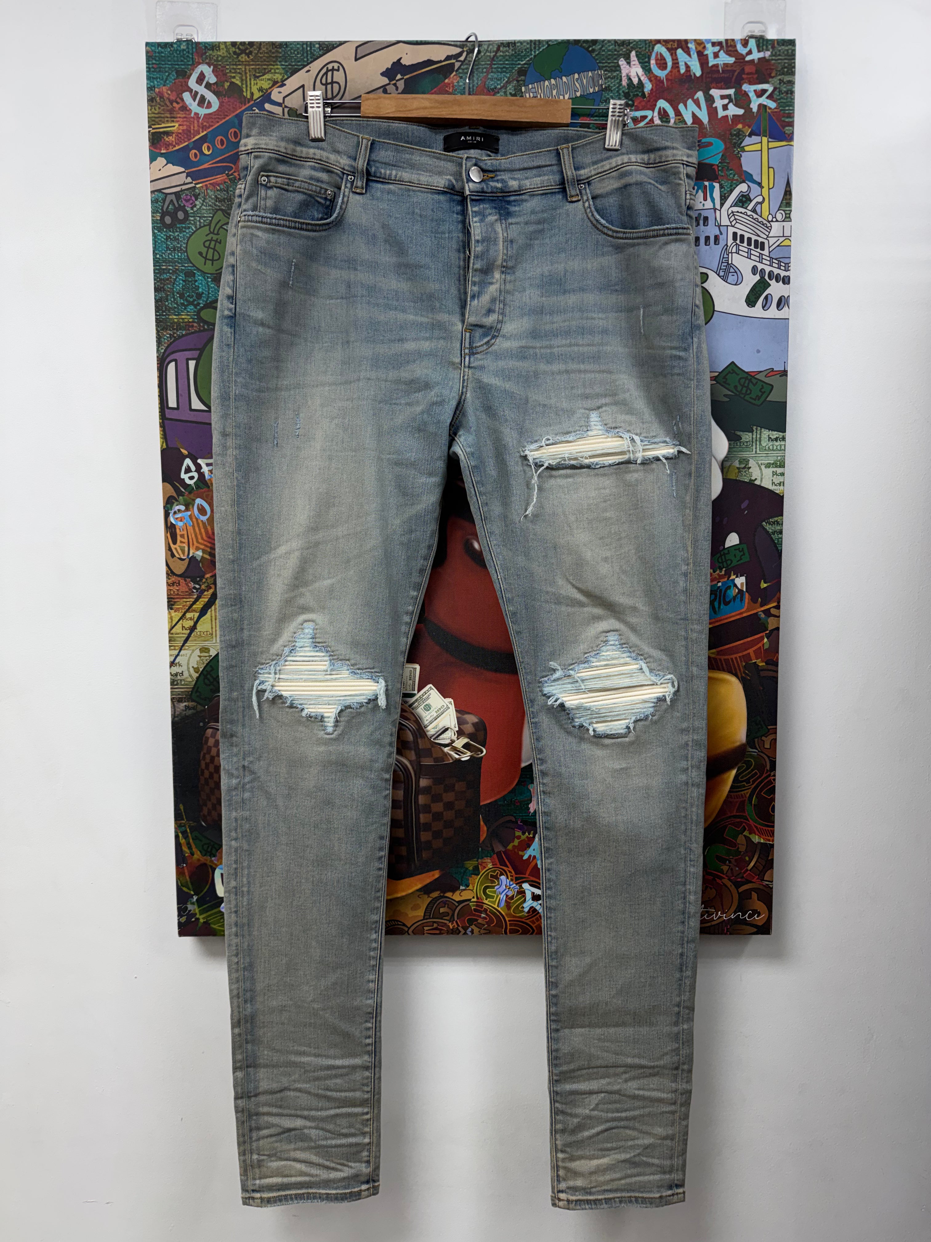 Amiri MX1 Light Wash White Ultra Suede Patch Jeans