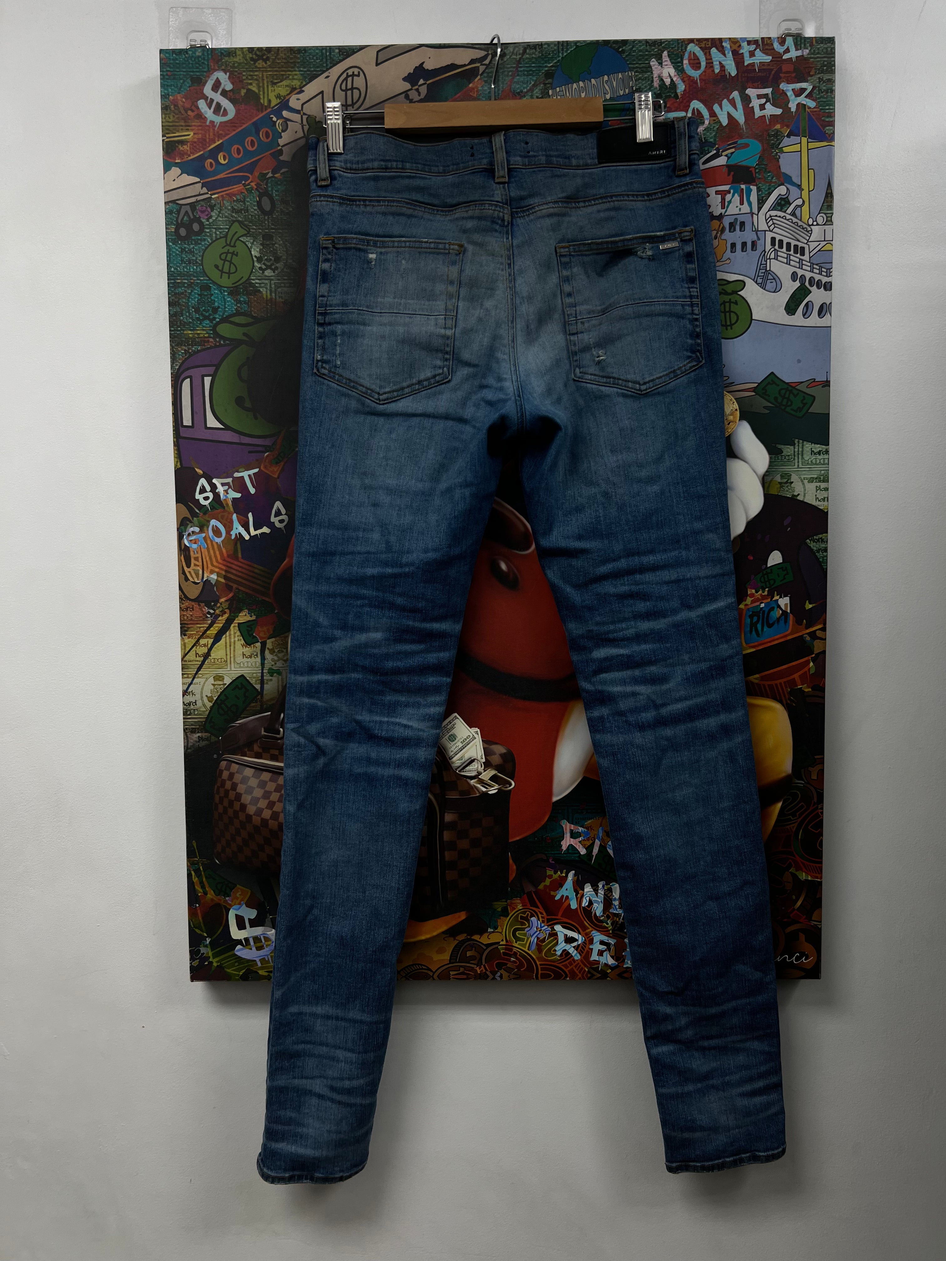 Amiri MX1 Light Wash Black Patch Jeans