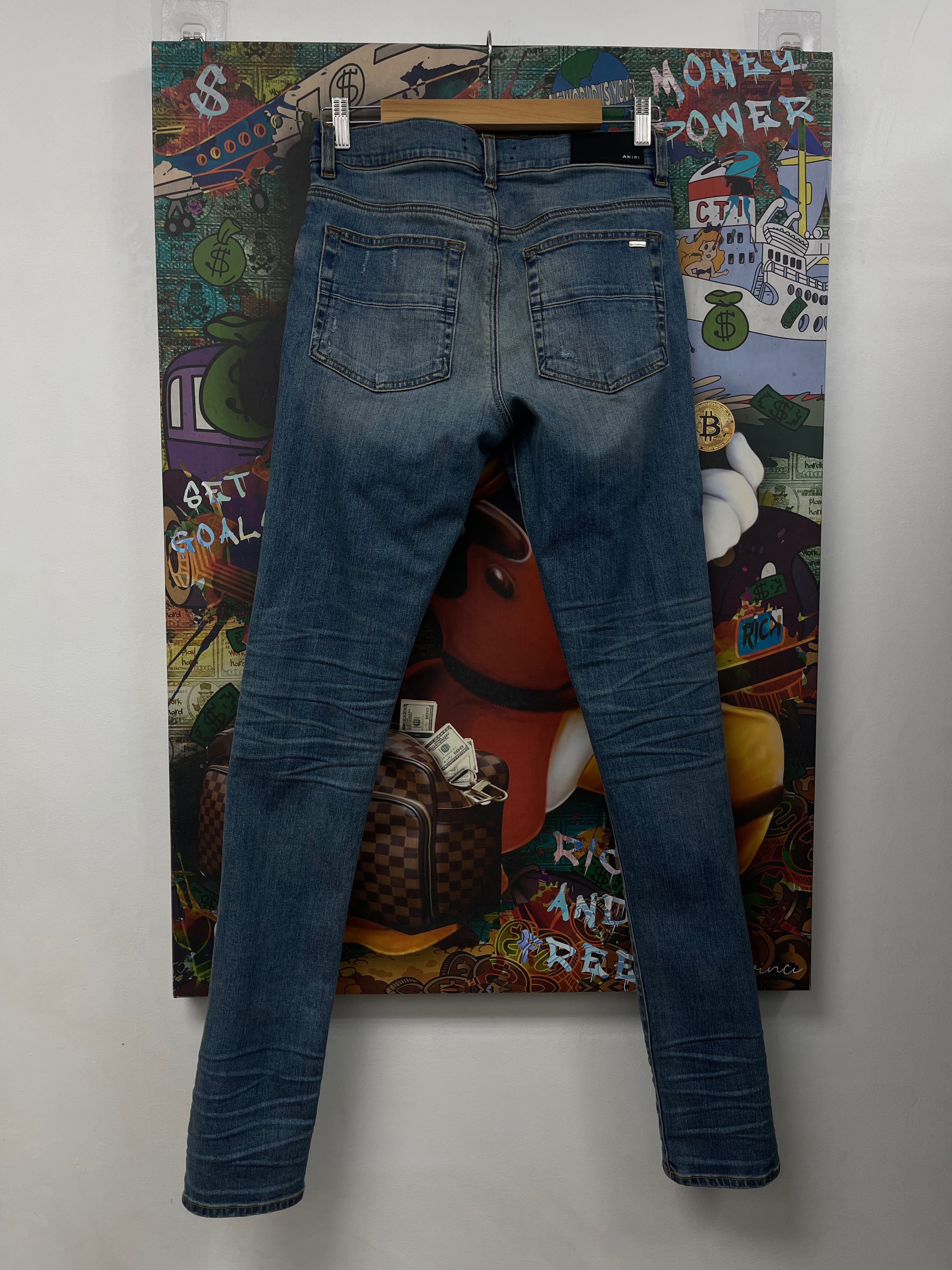 Amiri MX1 Light Wash Black Patch Jeans