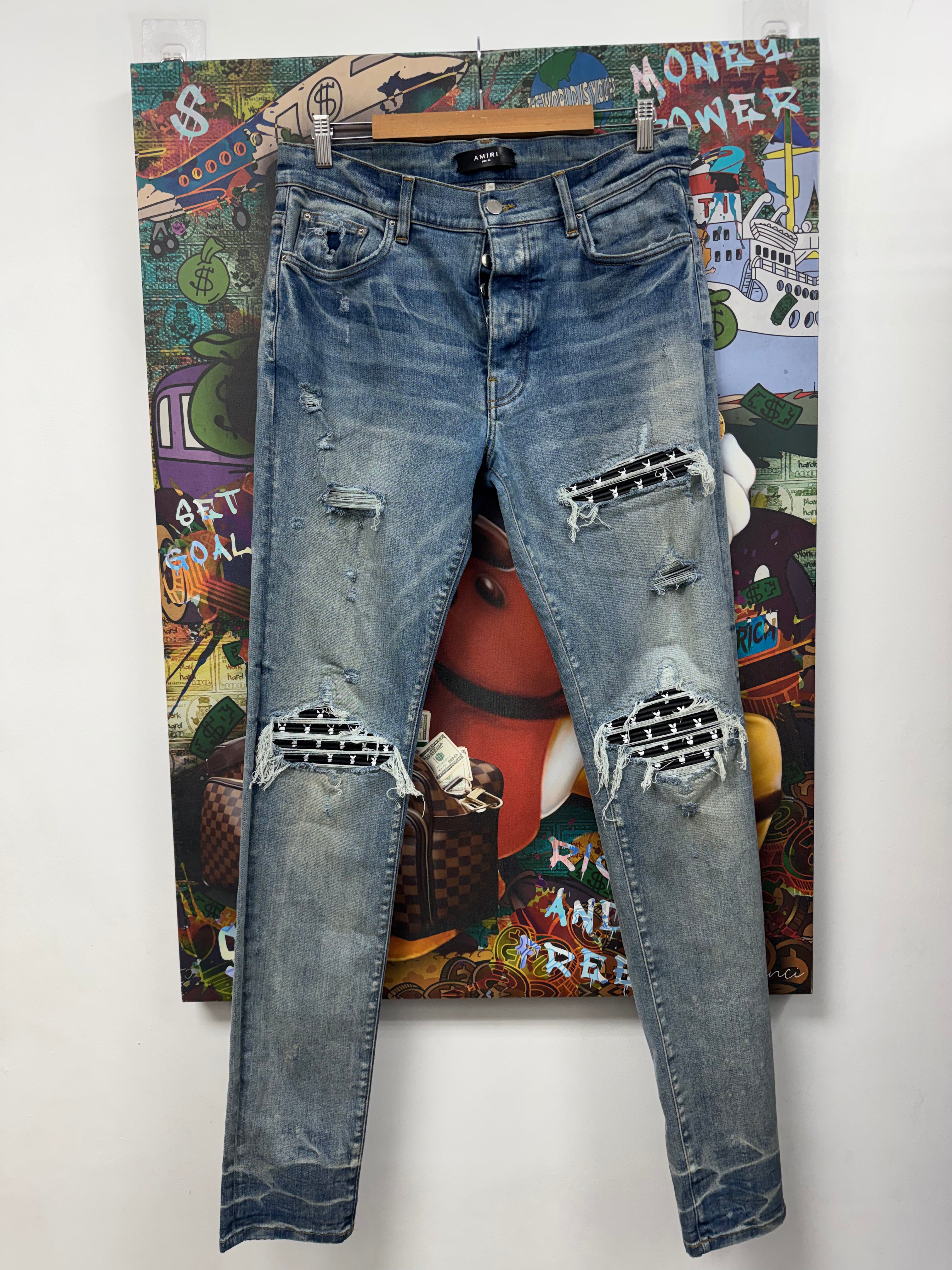 Amiri MX1 Light Wash Playboy Patch Jeans