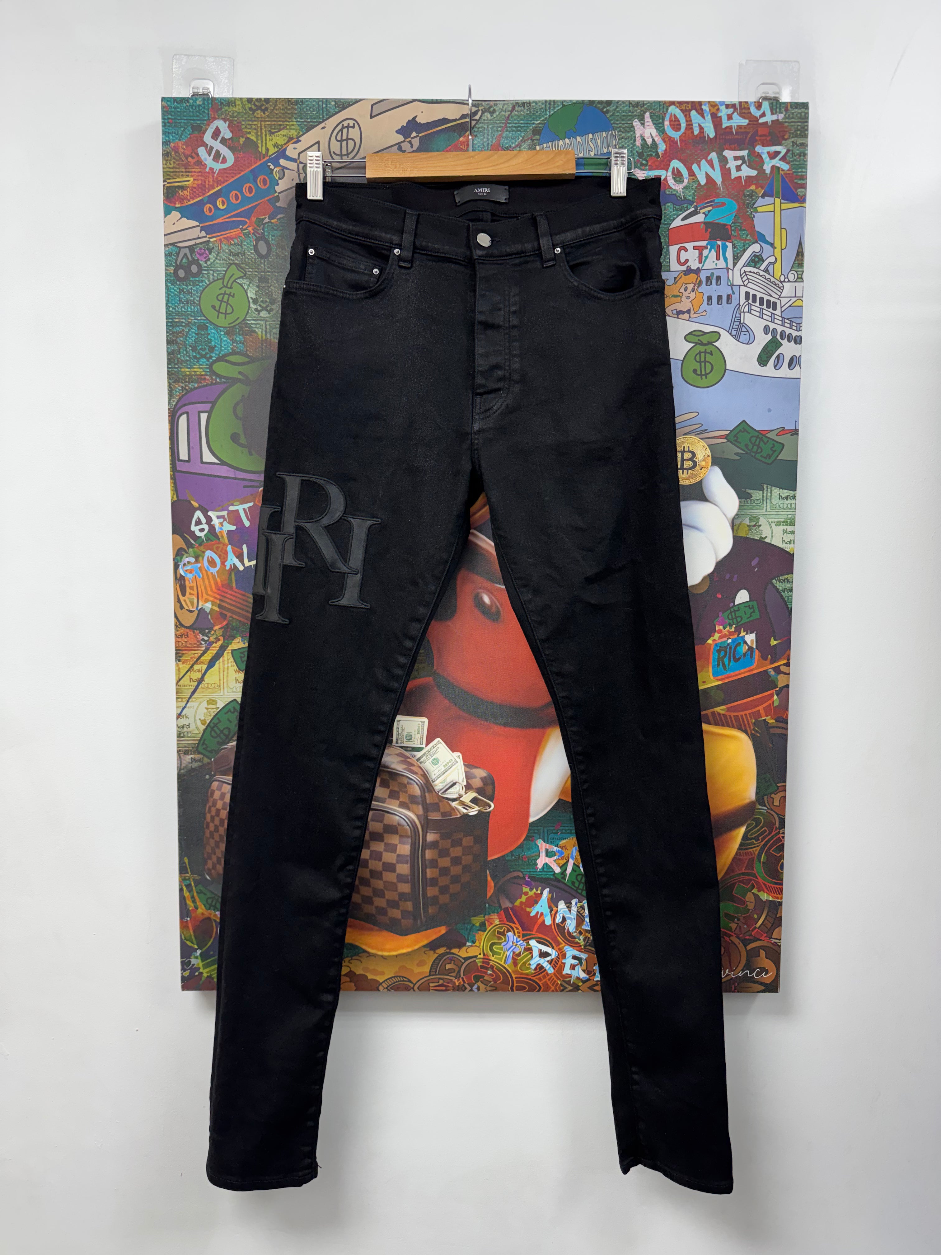 Amiri Black Wax Staggered Side Logo Jeans