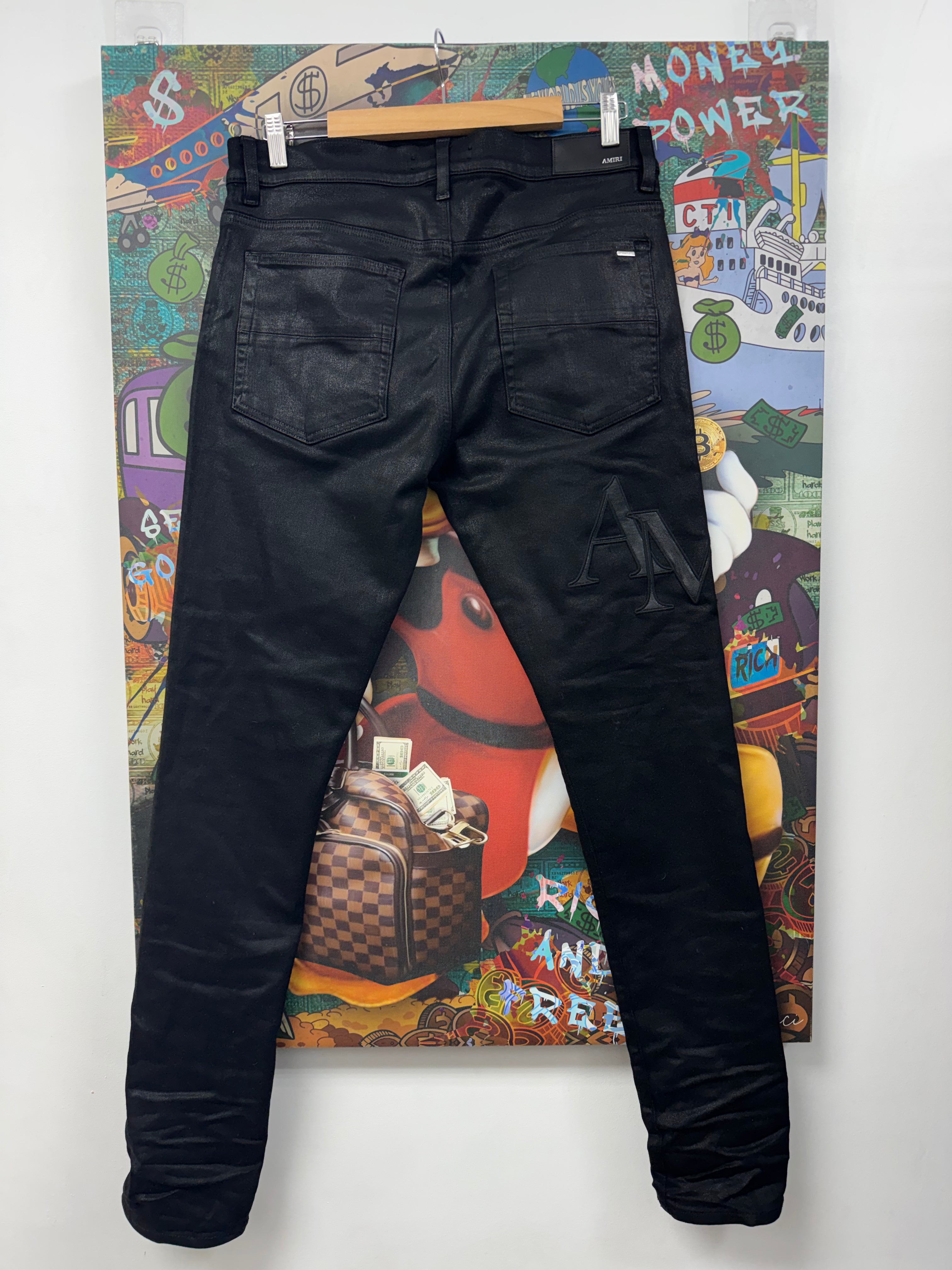 Amiri Black Wax Staggered Side Logo Jeans
