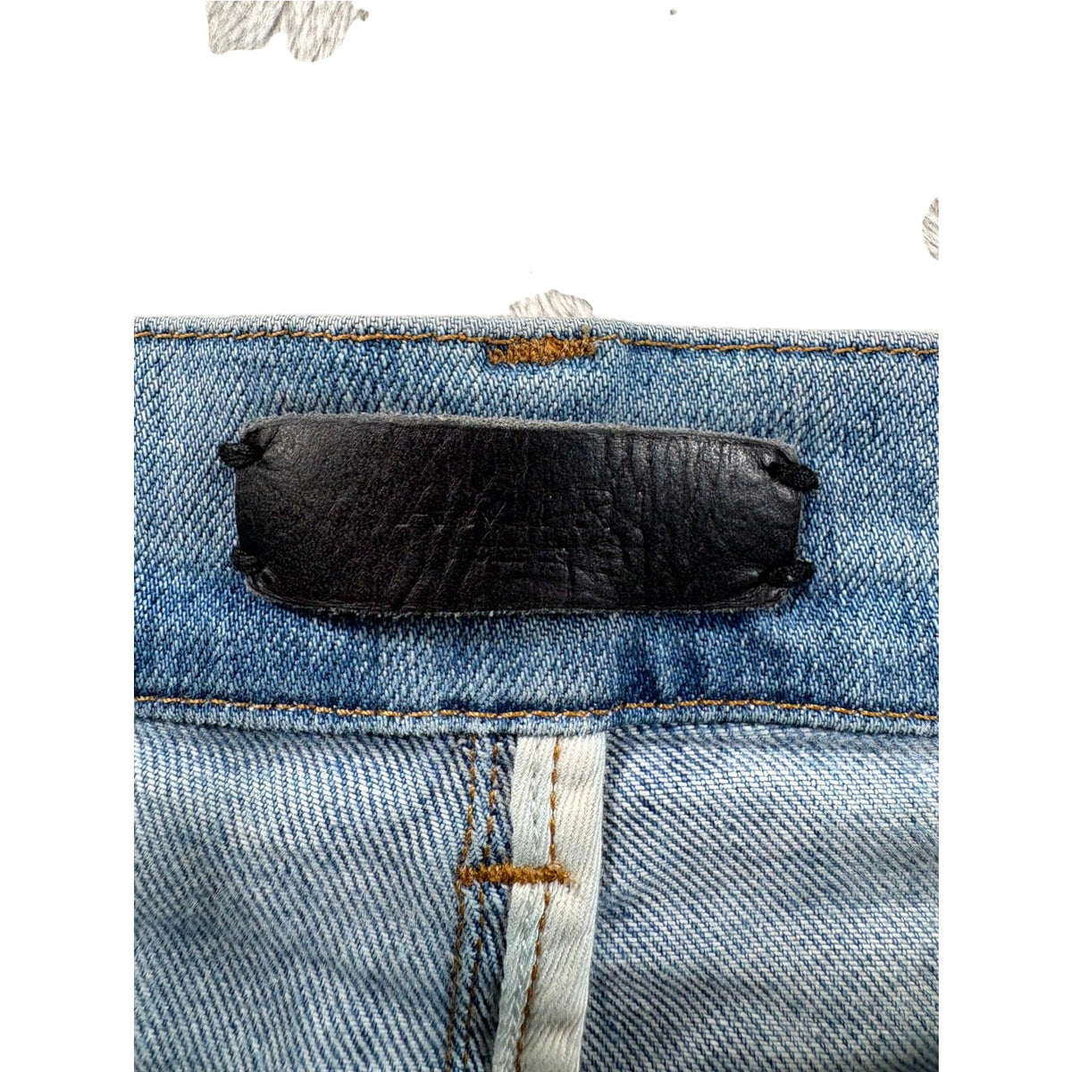 Amiri "MX1" Marble Patch Light Wash Jeans