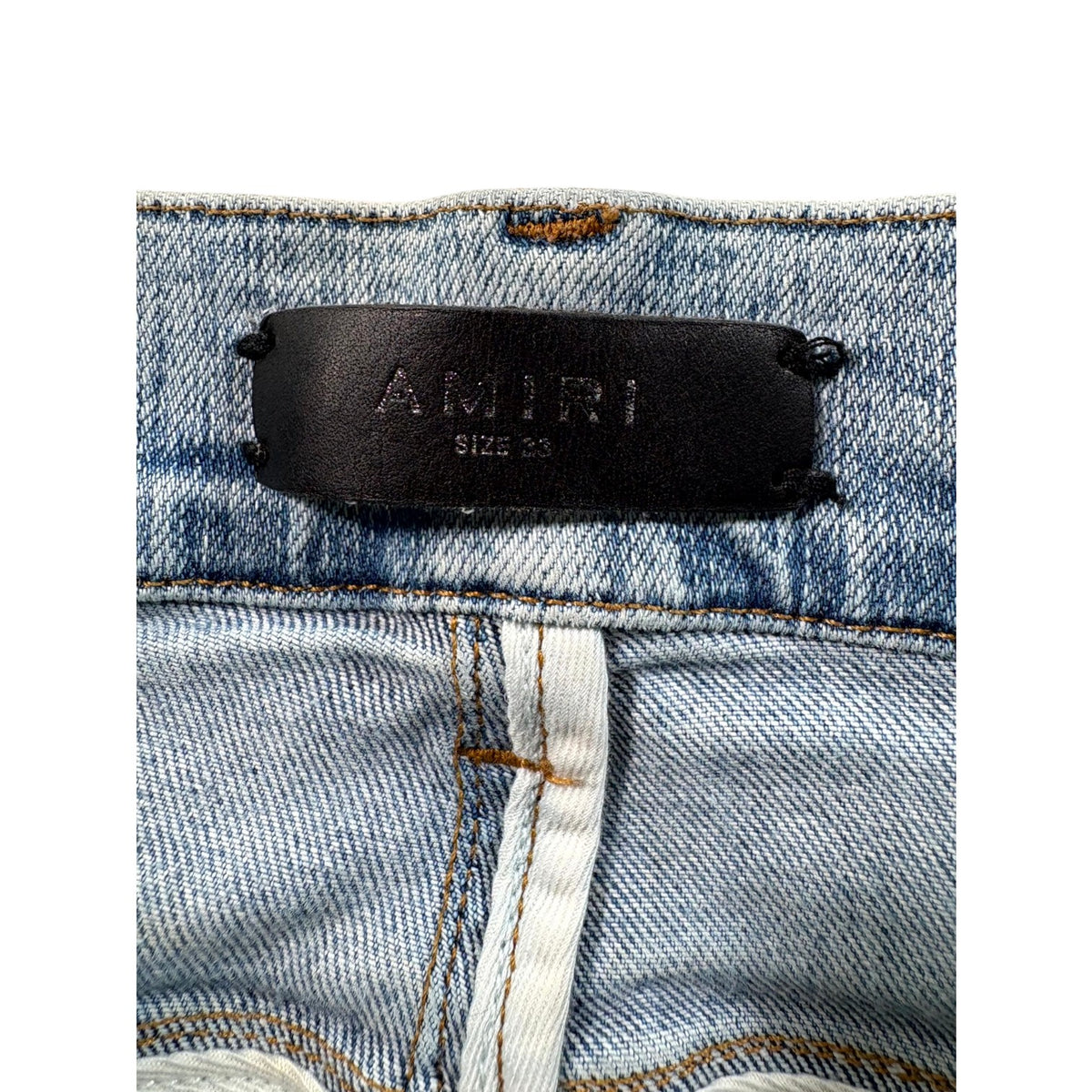 Amiri "MX1" Iridescent Light Wash Jeans