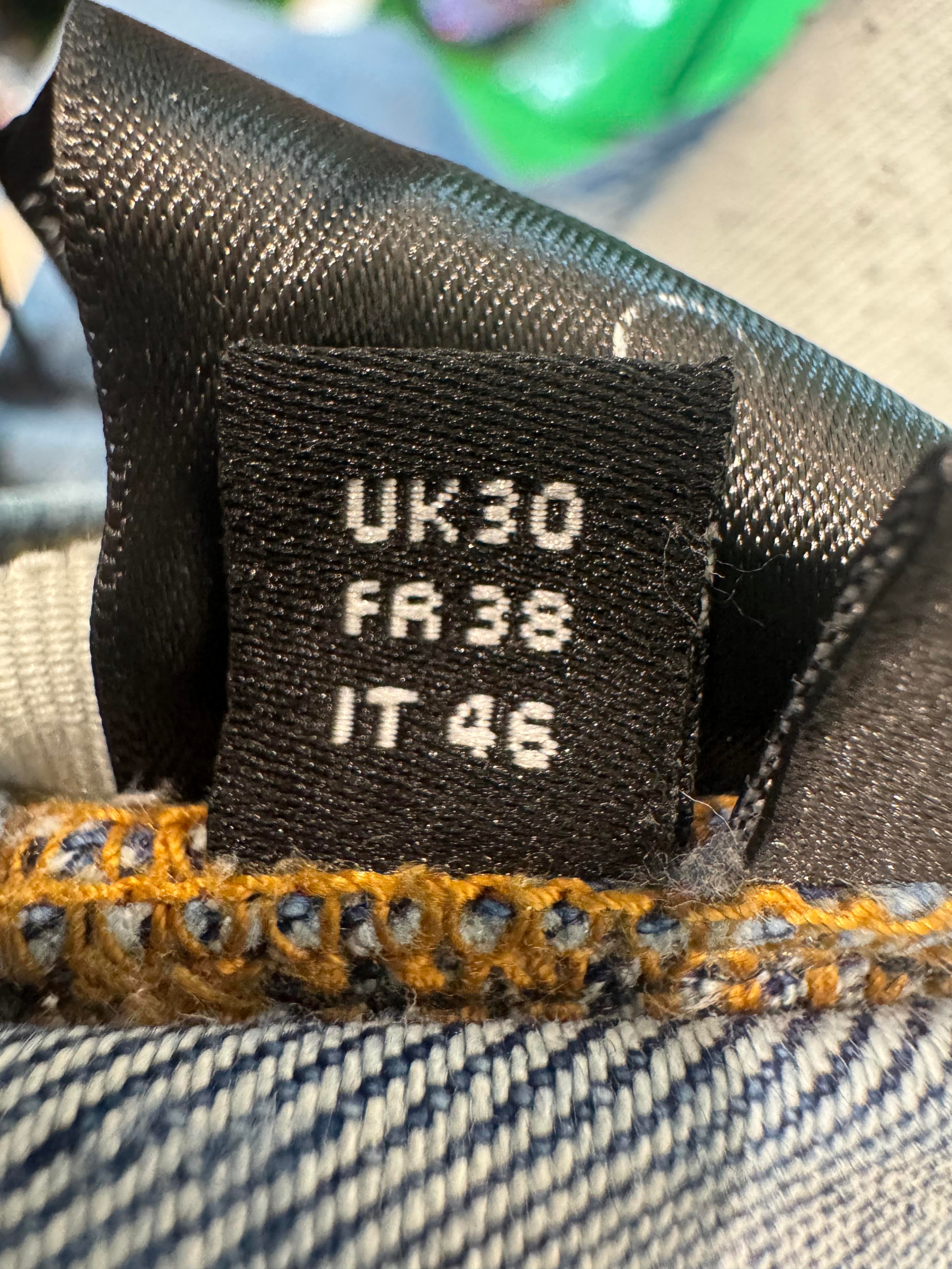 Amiri Knee Rip Light Wash Blue Jeans