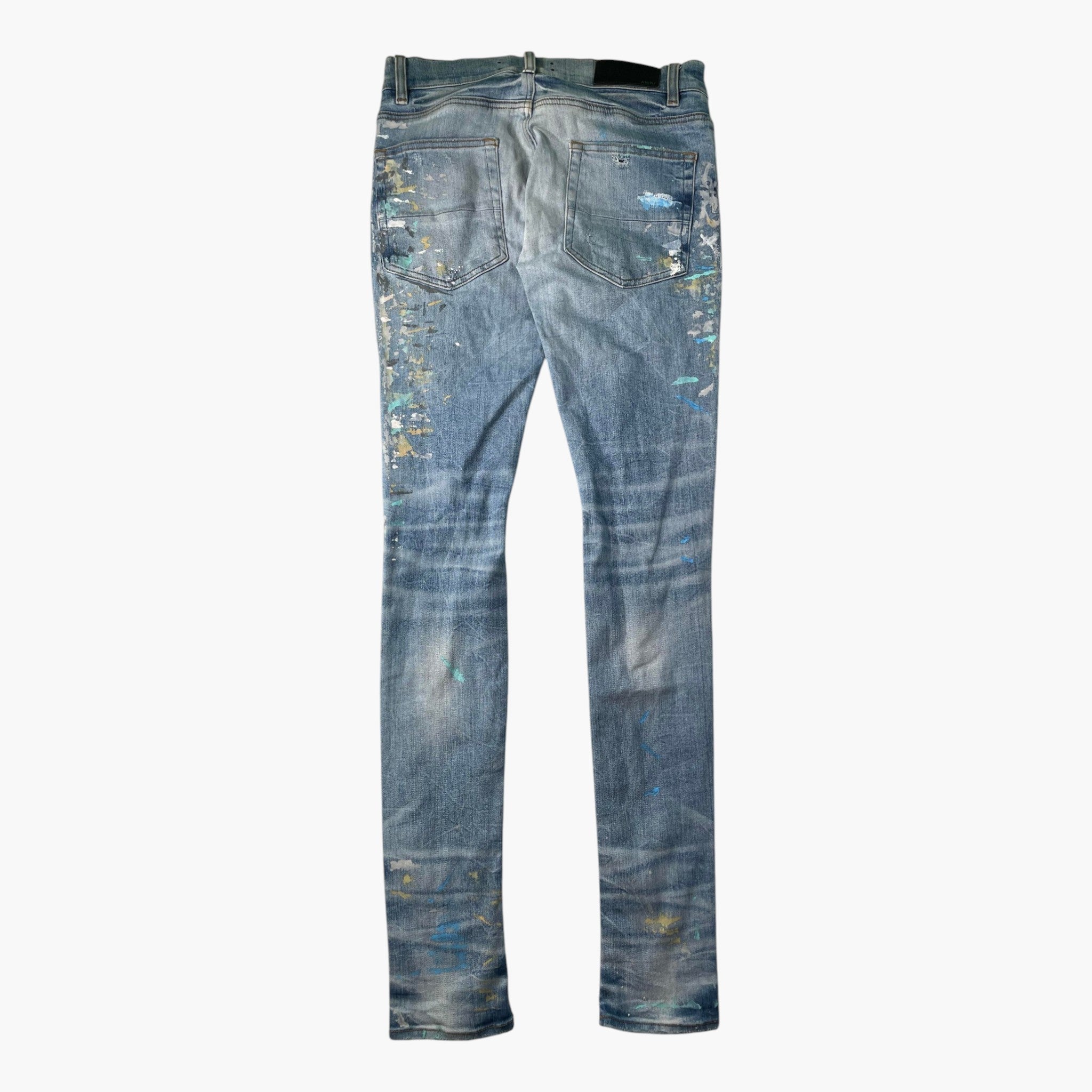 Amiri Paint Splatter Light Wash Knee Rip Jeans