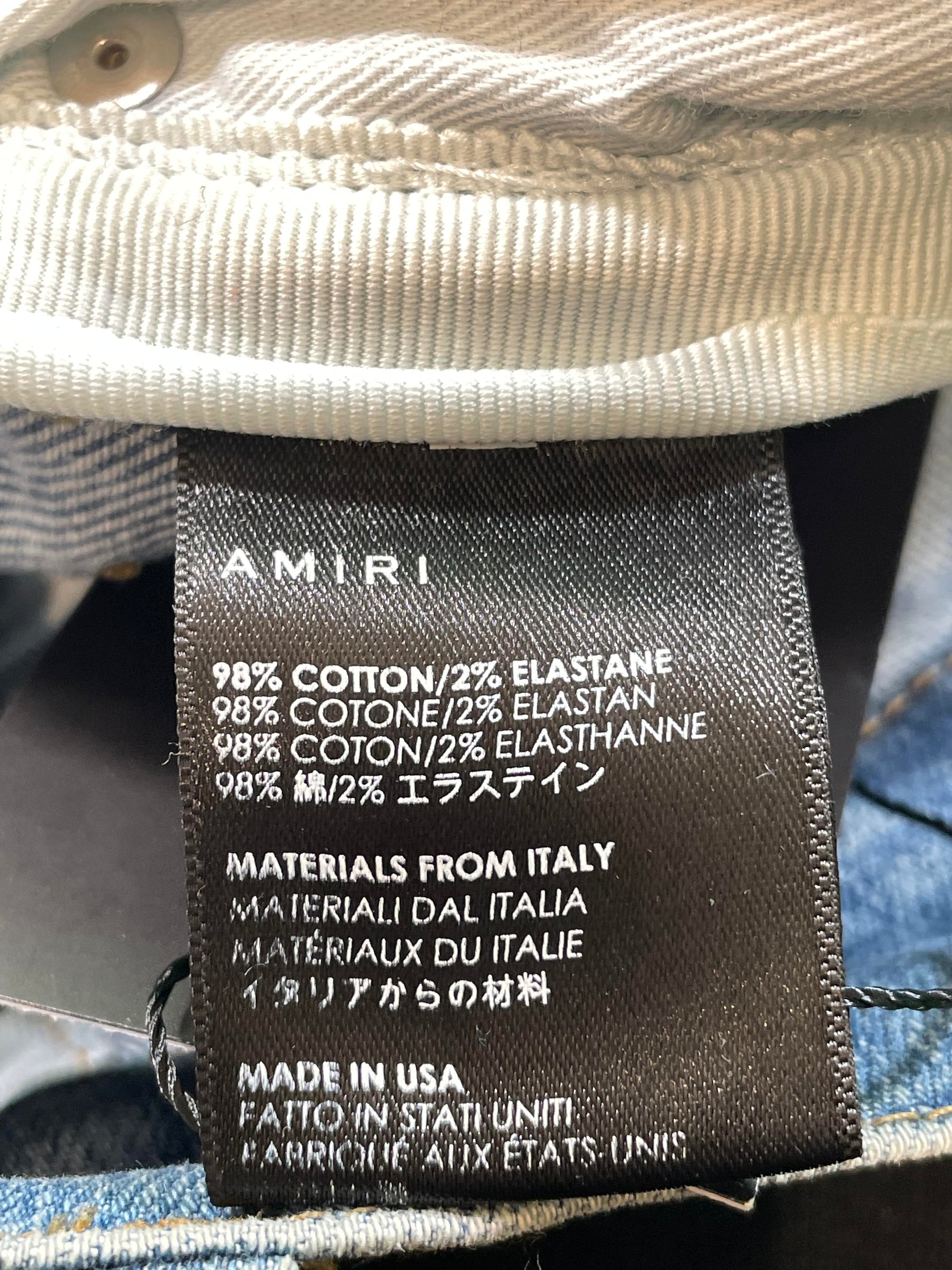 Amiri Paint Splatter Light Wash Knee Rip Jeans