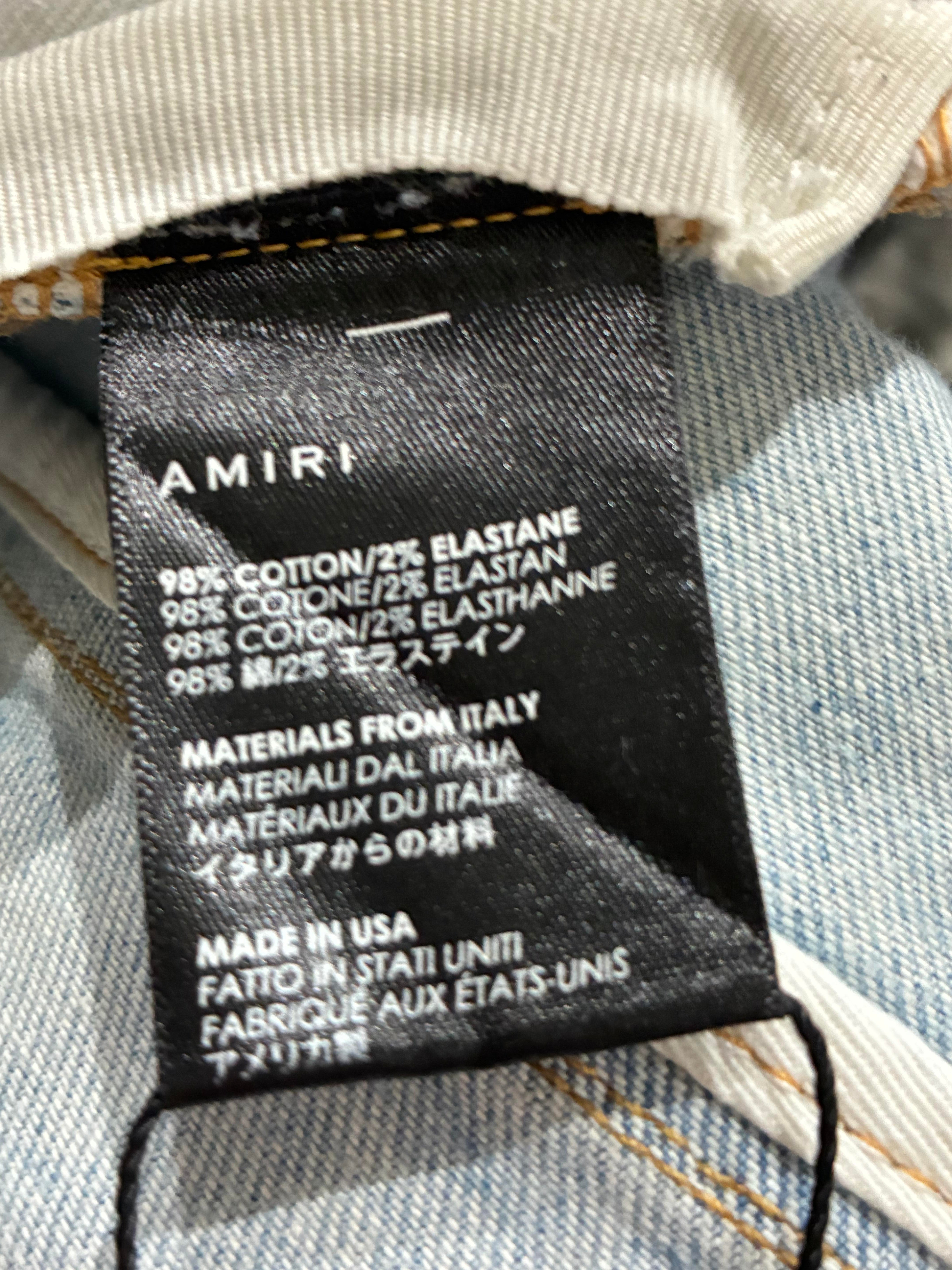 Amiri Ripped Thrasher Jeans