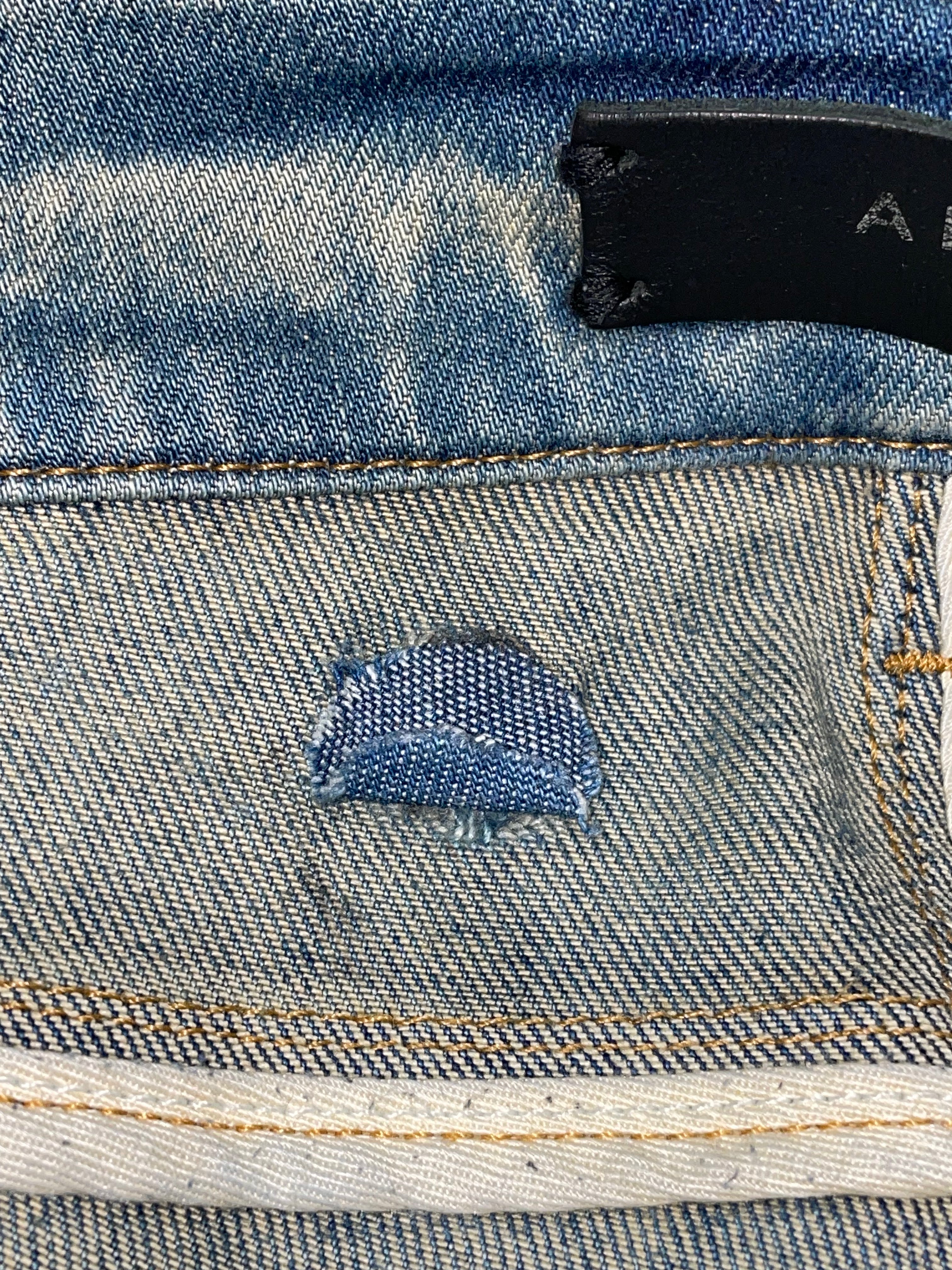 Amiri Knee Rip Vintage Wash Blue Jeans