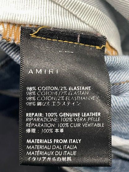 Amiri Mx1 Light Wash Black Patch Jeans