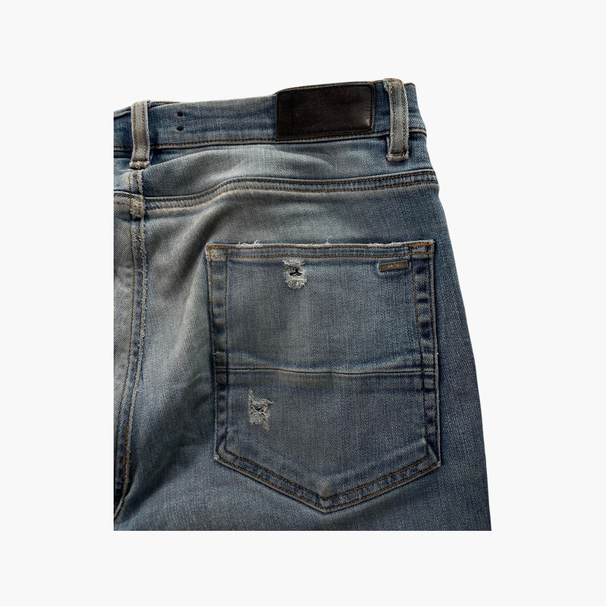 Amiri MX1 Black Suede Patch Light Wash Jeans