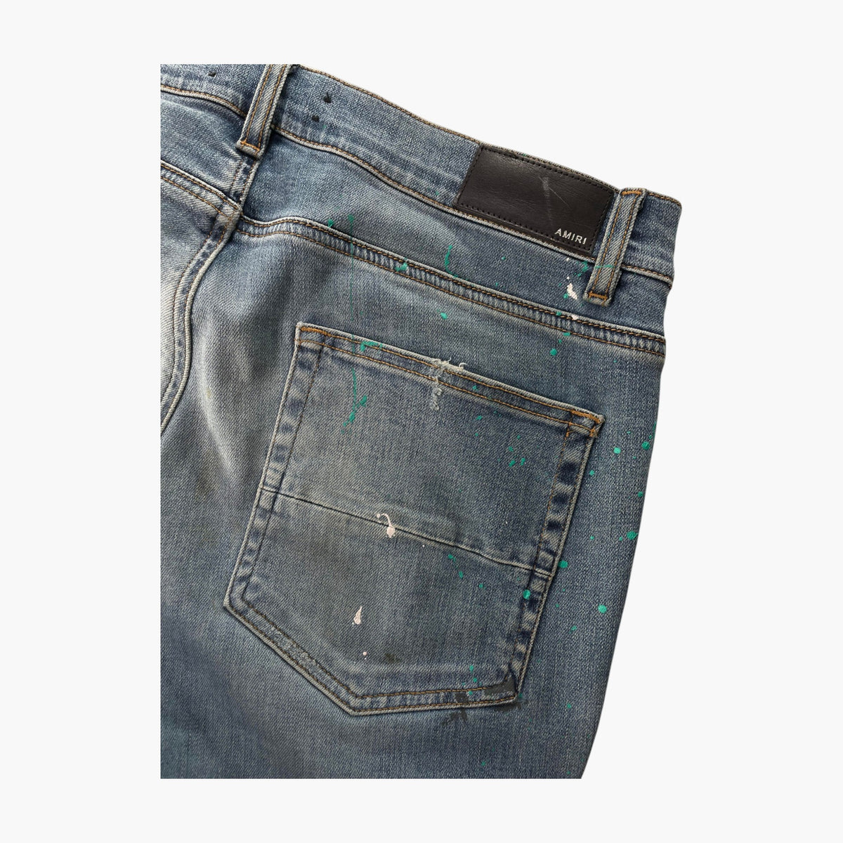 Amiri Teal Splatter Ripped Light Wash Jeans