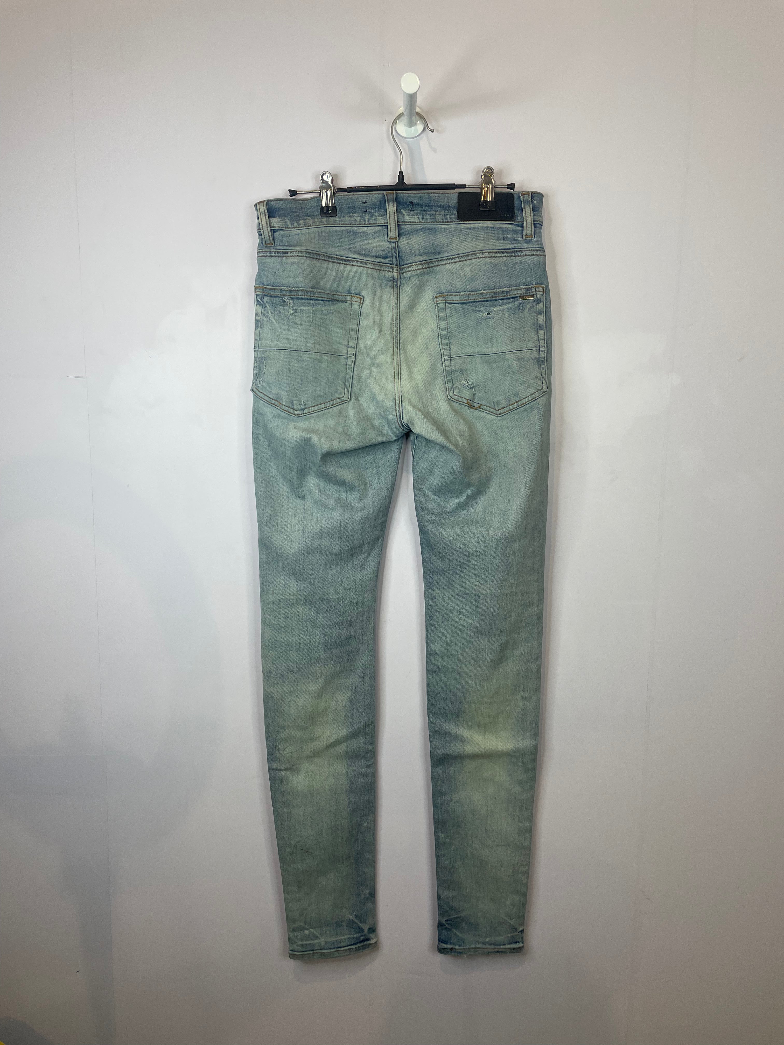 Amiri Light Wash Tie Dye Patch Blue Jeans